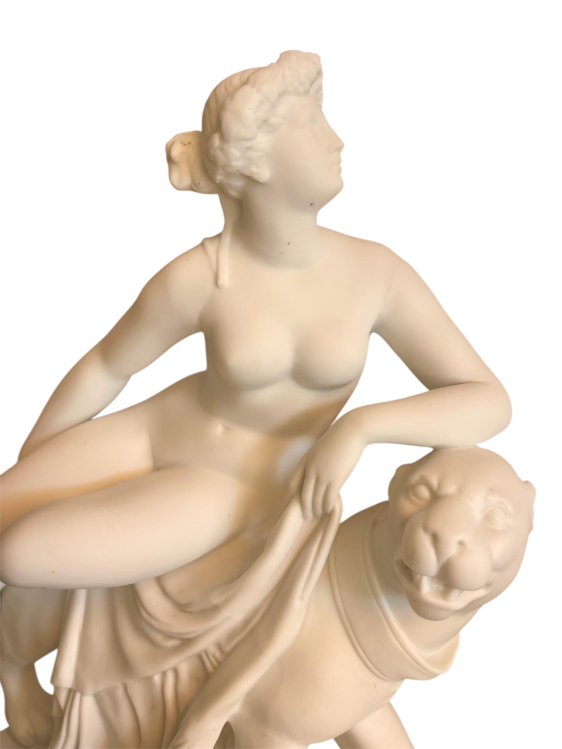 Biscuit sculpture representing Arianne riding a panther. Model after Johann Heinrich Dannecker. Very beautiful trinket, in good condition. 
 Numbered below 2380. 
 
 Note - tiny chip under the toes of Arianne's right foot. It is not visible but it