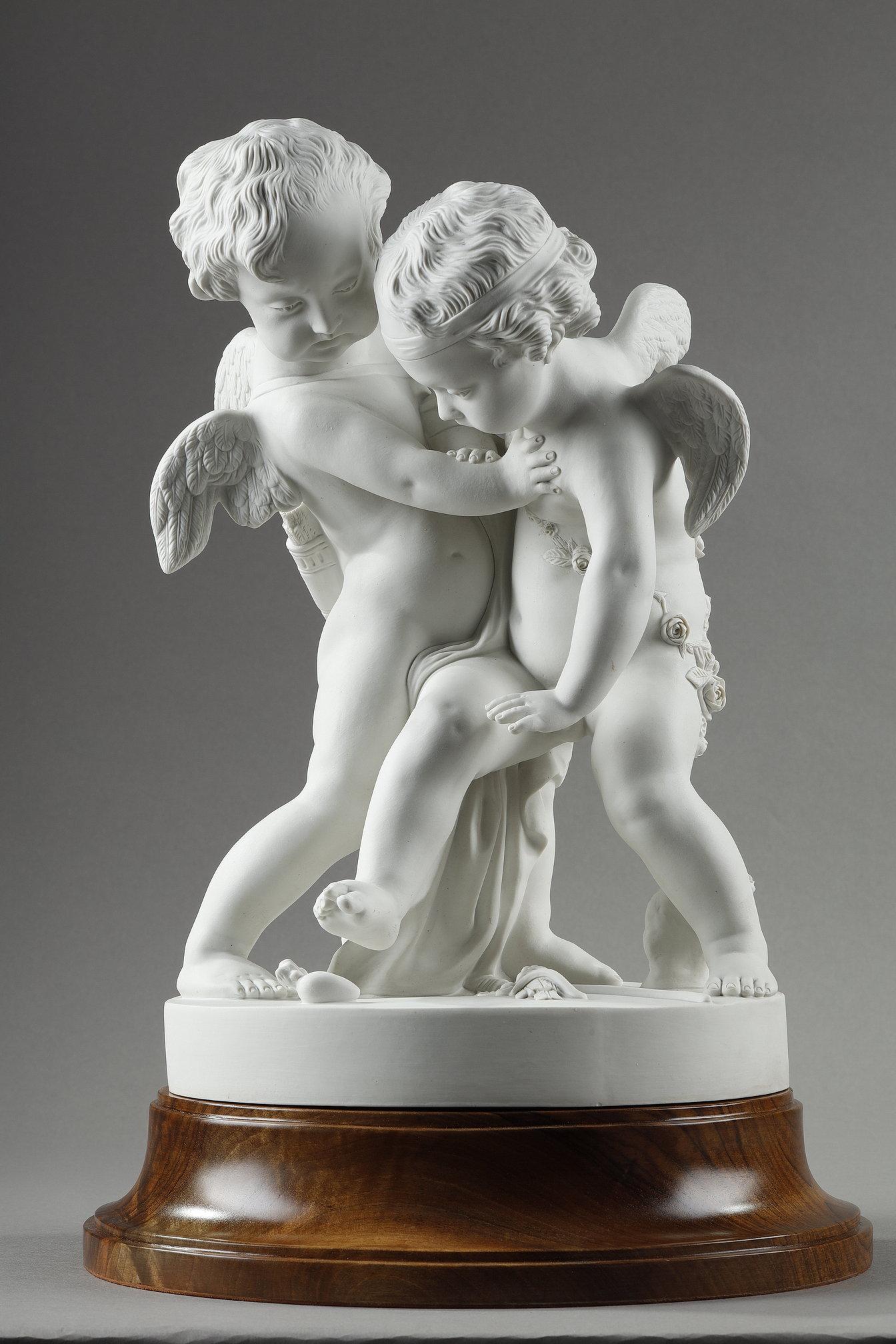 Statuette in biscuit porcelain after Étienne-Maurice Falconet (1716-1791). Two young winged lovers are depicted fighting to recover a heart shown on the base. The whole resting on a fine walnut wood base. Signed on the base Pigalle and marked