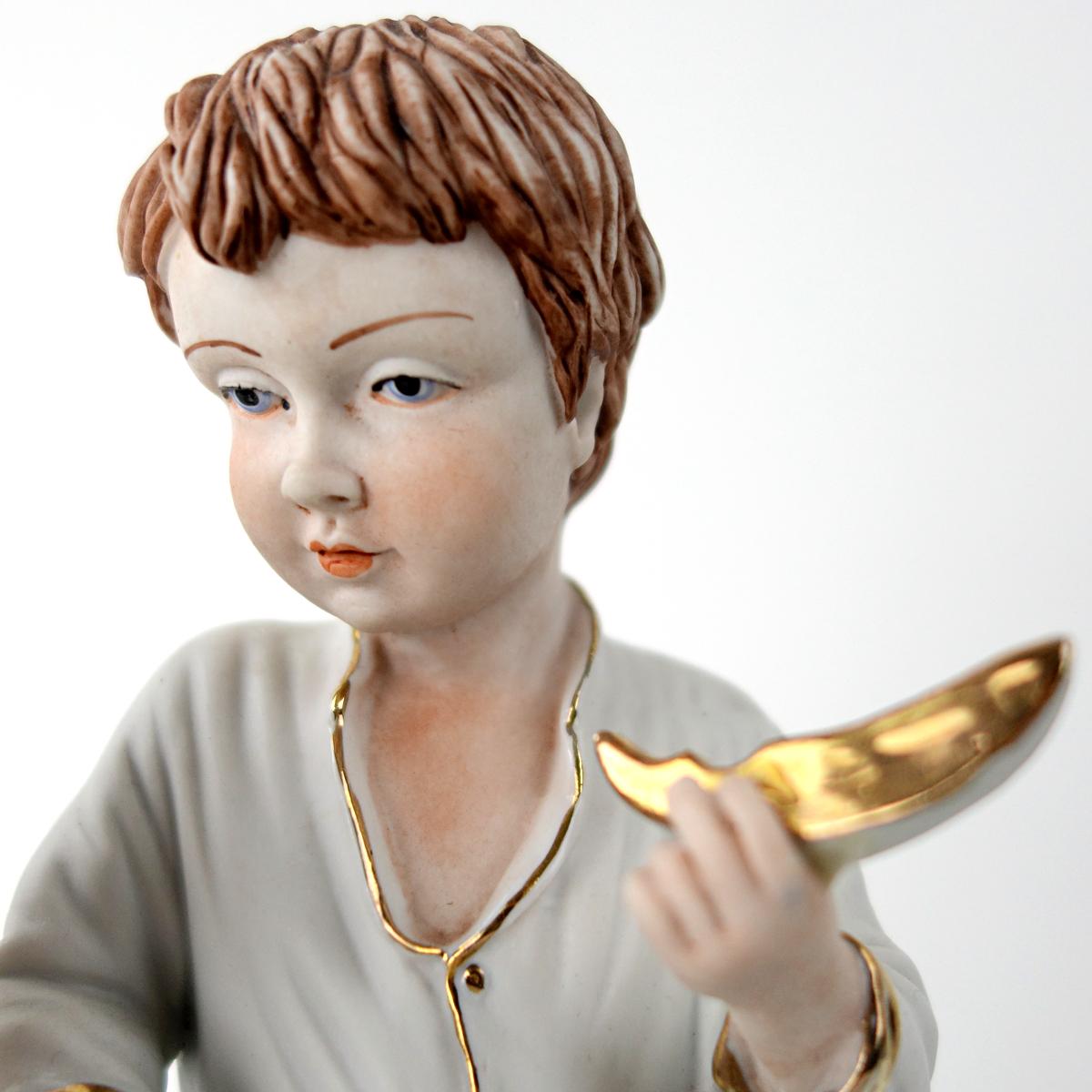 Dutch Biscuit Porcelain Statuette of Two Boys Eating a Melon with Gold-Colored Details For Sale