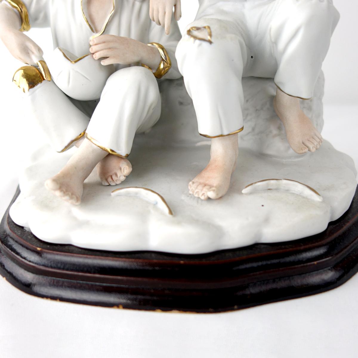Biscuit Porcelain Statuette of Two Boys Eating a Melon with Gold-Colored Details In Good Condition For Sale In Doornspijk, NL
