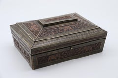 Biscuit tin made by Hunter and Palmer depicting an Indian carved box. English
