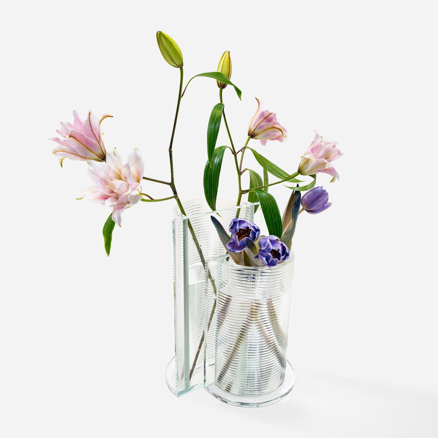 Made using Evenline's one-of-a-kind molten glass 3D printer, Bisect is a unique and recognizable silhouette to brighten up your home and bring your favorite flowers to life. Bisect is designed to be able to shine as a single vase, but also pairs