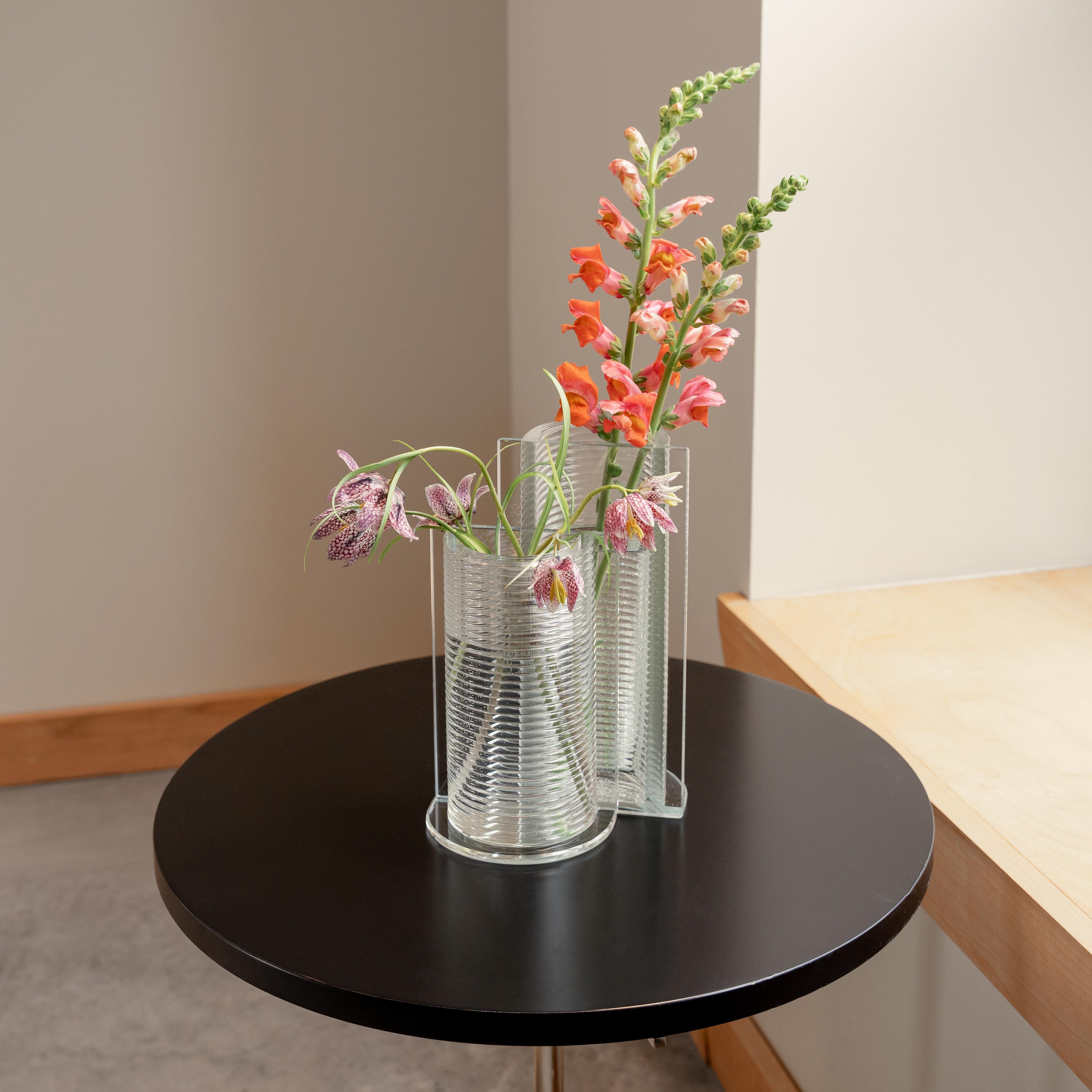 Made using Evenline's one of a kind molten glass 3D printer, Bisect is a unique and recognizable silhouette to brighten up your home and bring your favorite flowers to life. Bisect is designed to be able to shine as a single vase, but also pairs