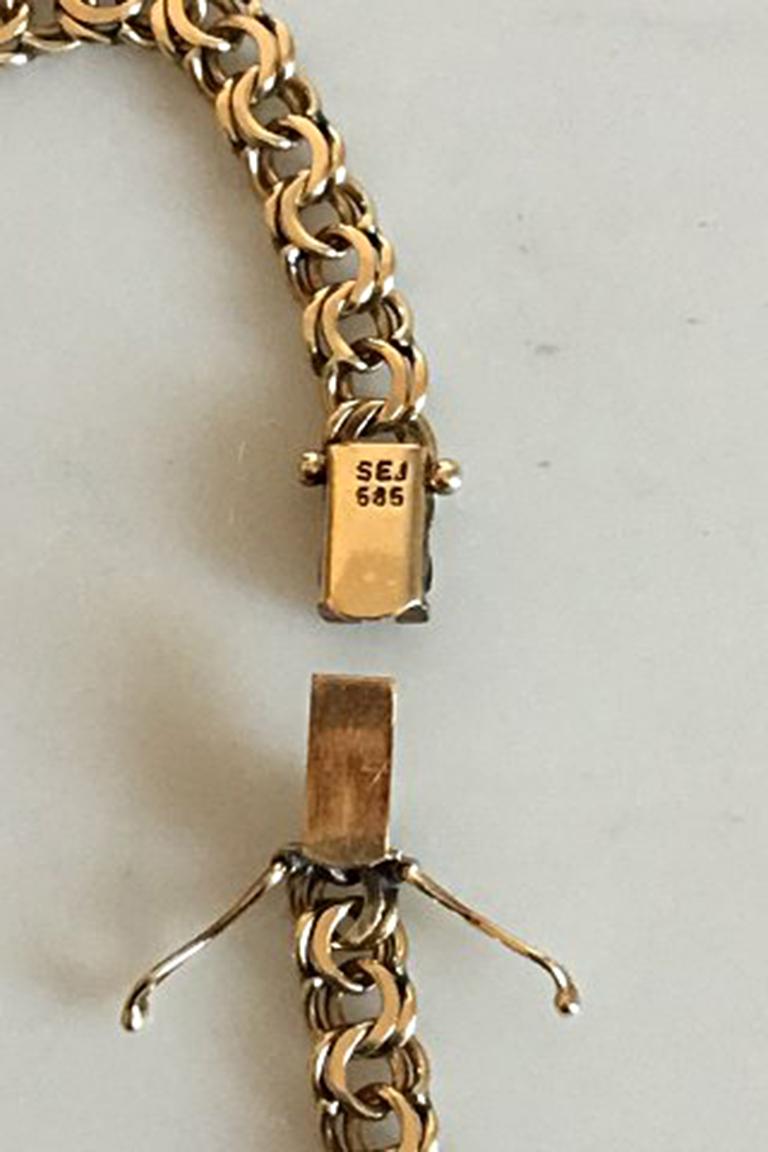 Bismarck chain in 14K Gold. Measures 44 cm / 17 21/64 in. Width 5.5 mm - 9.5 mm. Weighs 29.9 g / 10.5 oz. Stamp SEJ 585