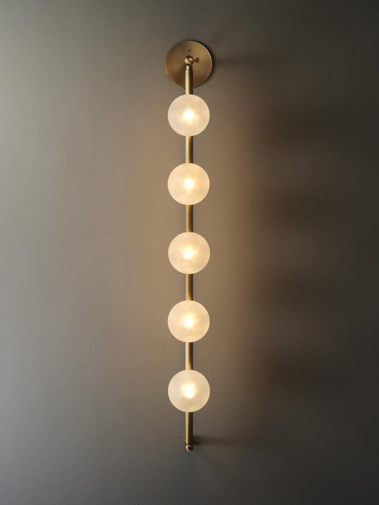 Introducing Bisou, the new wall lamp design by blueprint lighting. Bisou is an overscaled stunner that kisses light into the room, creating the loveliest candlelit glow. Pairs well with our popular Fauchard leaning floor lamp.
Fabricated in brass