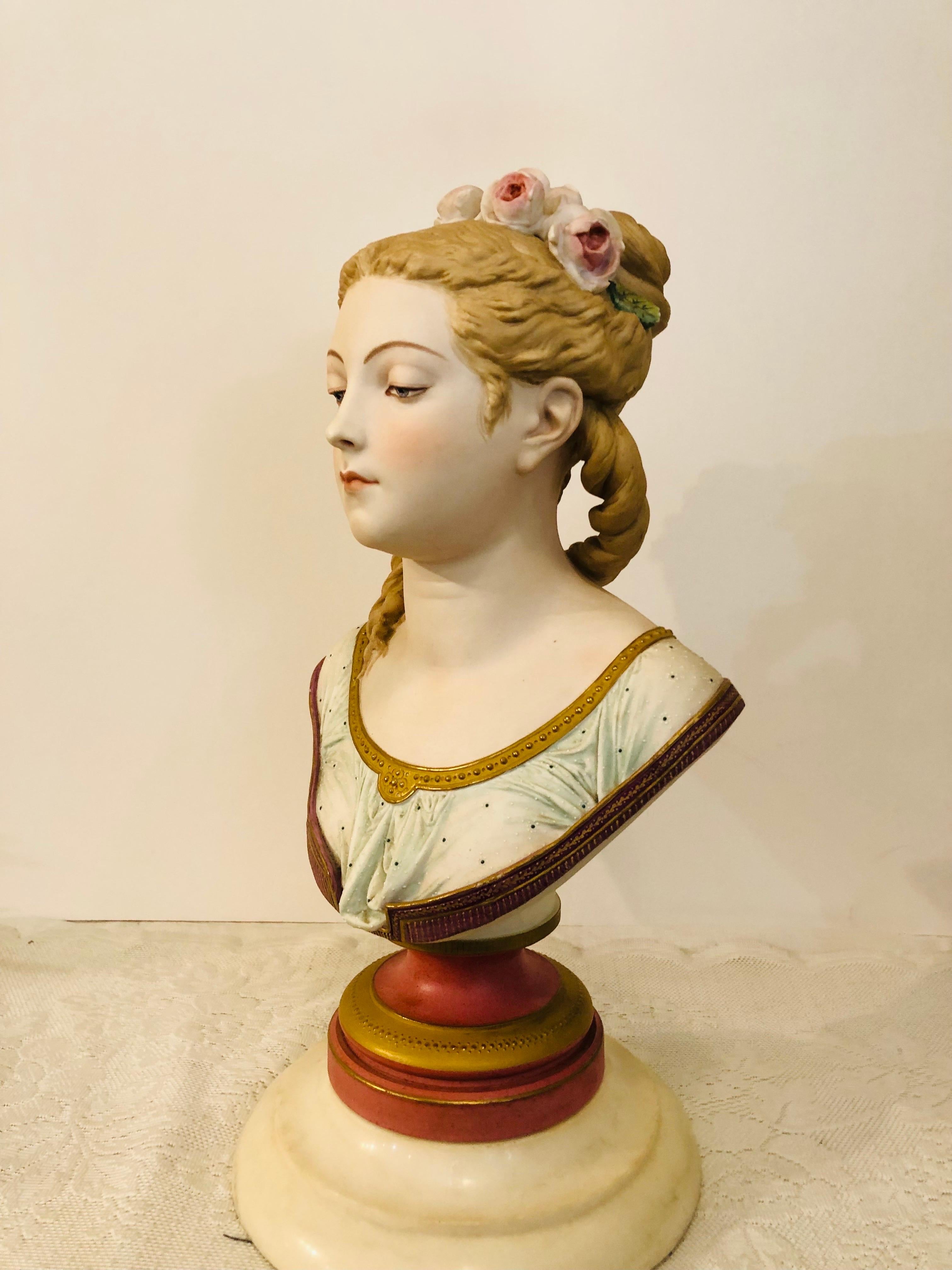 I want to present to you this wonderful painted bisque French bust artist signed A. Carrier and dated 1865. Albert Carrier Belleuse, the modeler, was the director of the Sevres porcelain company in the 1890s. This bust is of a beautiful lady with