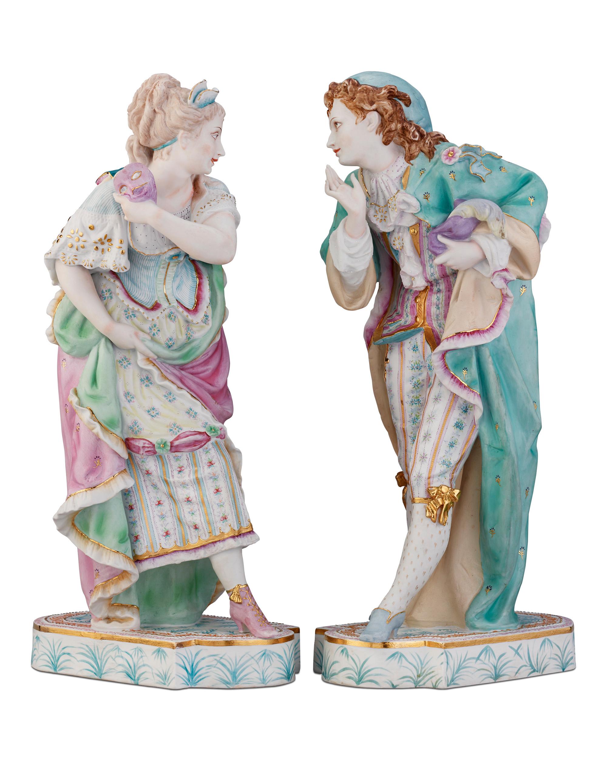 This splendid bisque porcelain figural group depicting a lavishly-dressed couple is crafted in the manner of Jean Gille. The lively pair are dressed for a masquerade ball complete with colorful costumes and masks. Their clothing is painted in soft