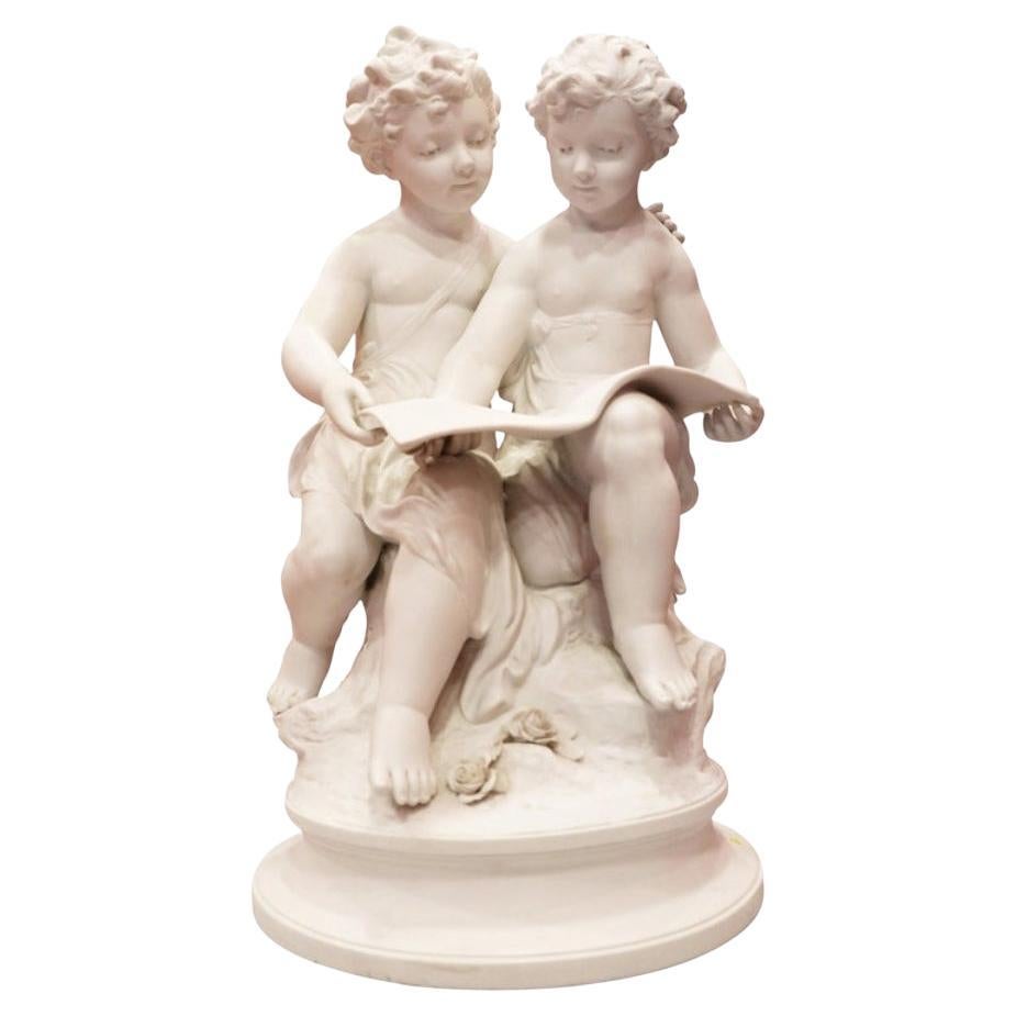 Bisque Porcelain a Stature of Boy and Girl Reading a Book, French, 19th Century For Sale