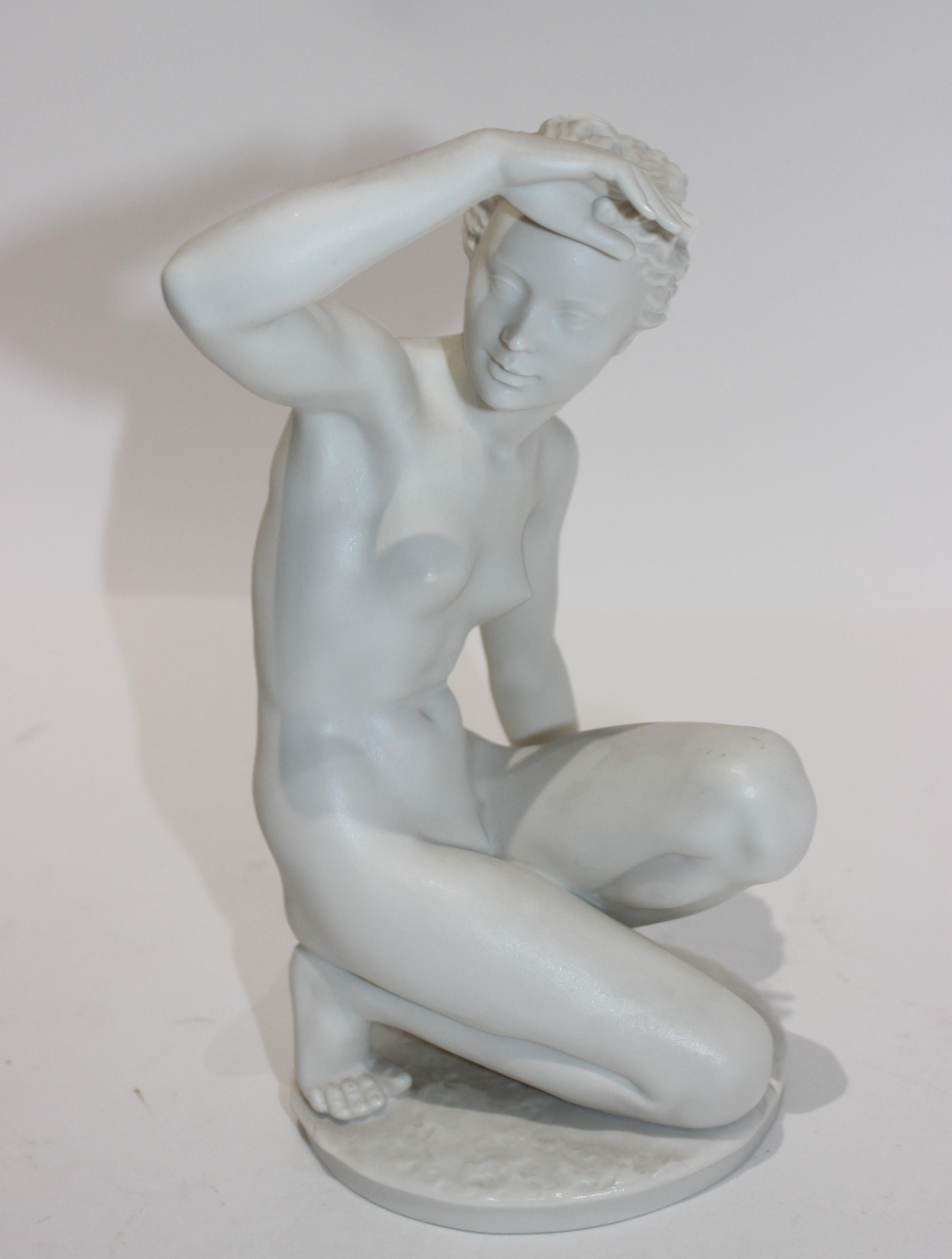 This stylish and chic bisque figure of a nude female dates to the 1960s, and is a reissue of an earlier 1940s piece produced by Hutschenreuther of Germany. 
