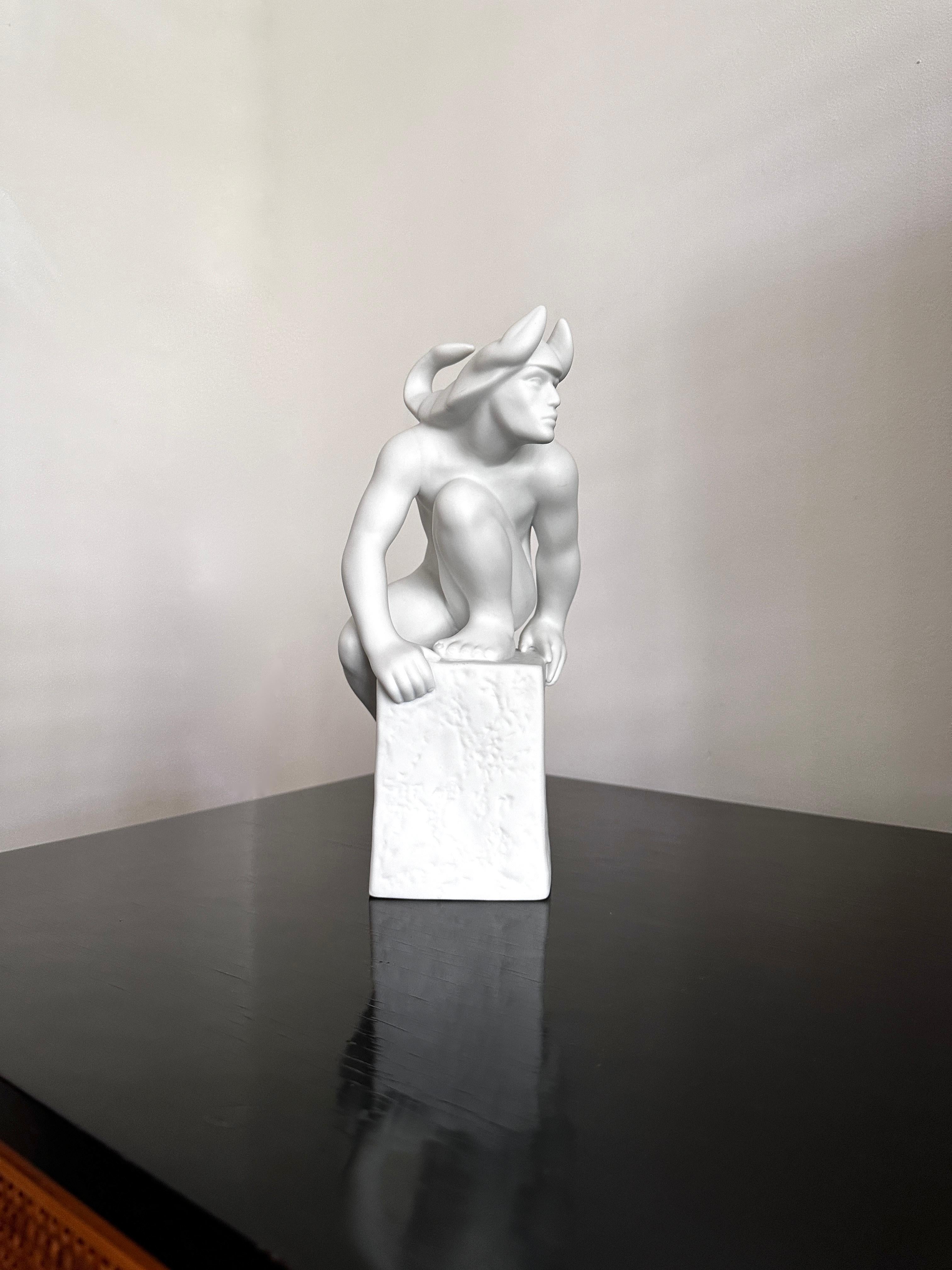 Beautiful bisque, matte white, statue of a man designed by Pia Langelund for Royal Copenhagen. The statue is one of the zodiac figures and this statue represents Scorpio. Designed probably sometime in the 1990's and has been discontinued. The