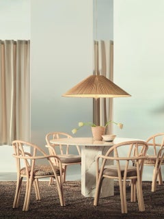 Bistra Dining Armchair in Natural Lacquered Rattan by AMDL Circle for GUBI