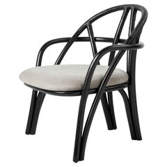 Sedia da salotto 'Bistra' in rattan verniciato color ebano di AMDL Circle per Gubi