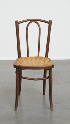 Bistro chair with a woven cane seat
