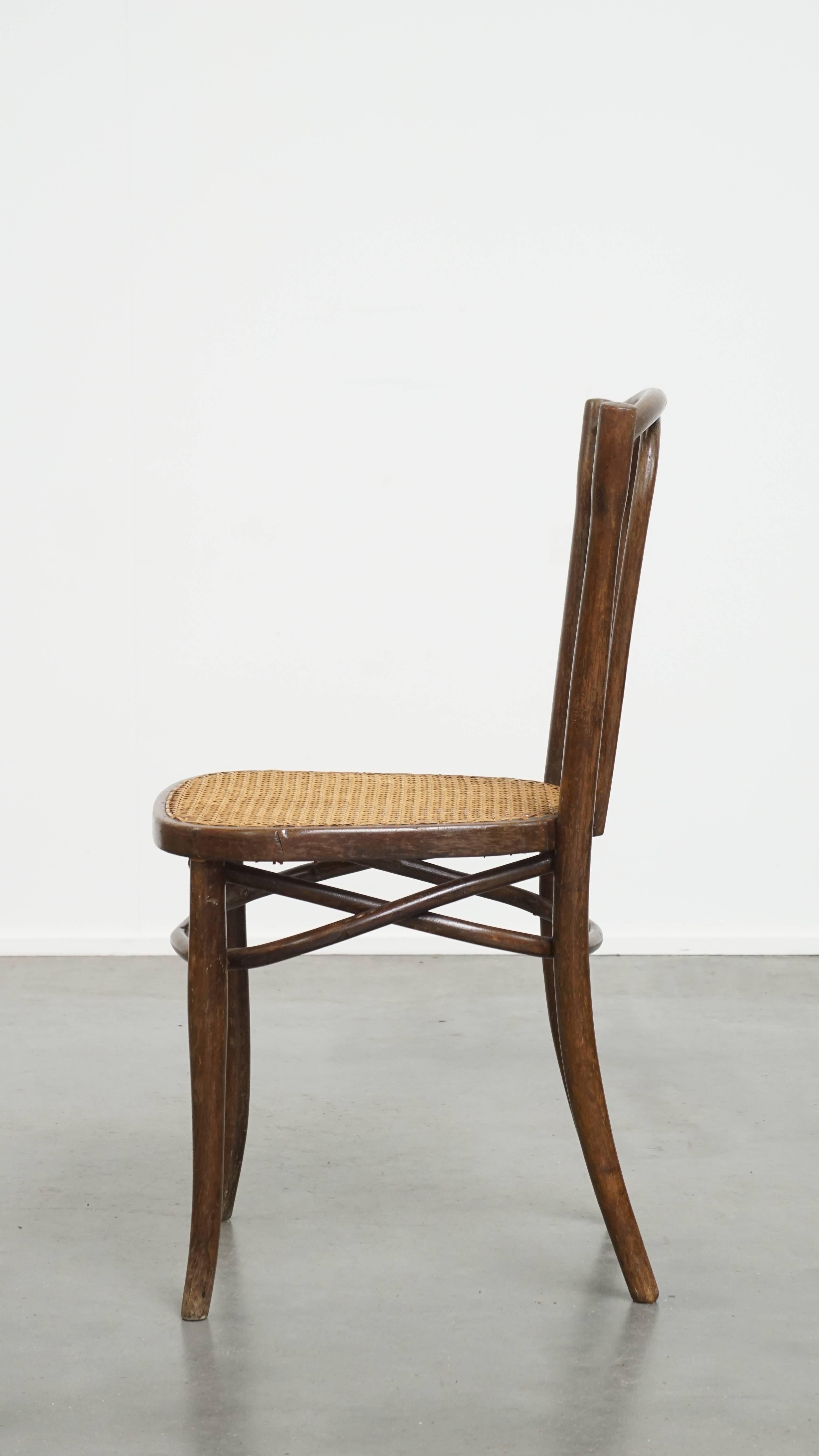 Hand-Crafted Bistro chair with a woven cane seat For Sale