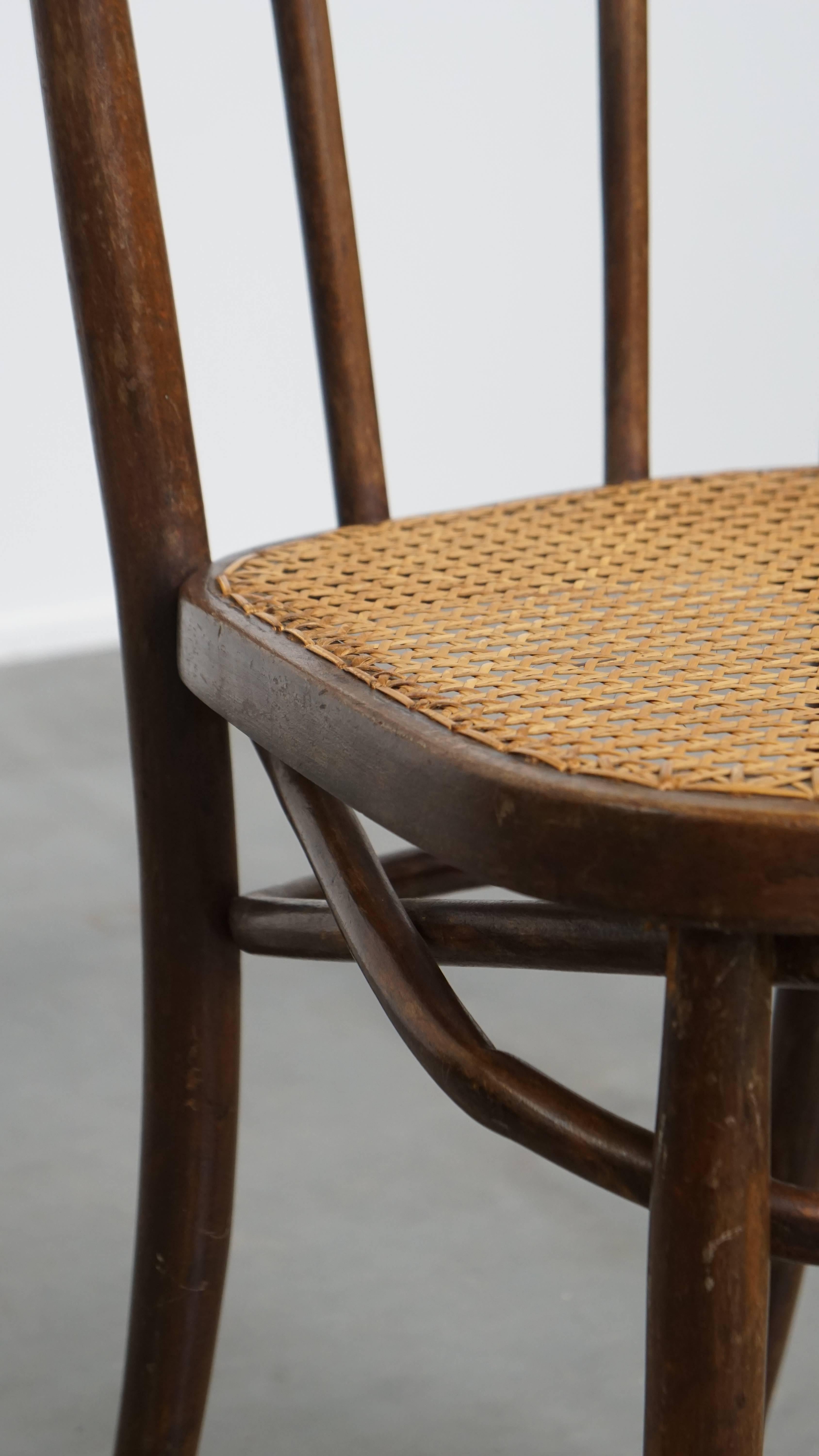 Cane Bistro chair with a woven cane seat For Sale