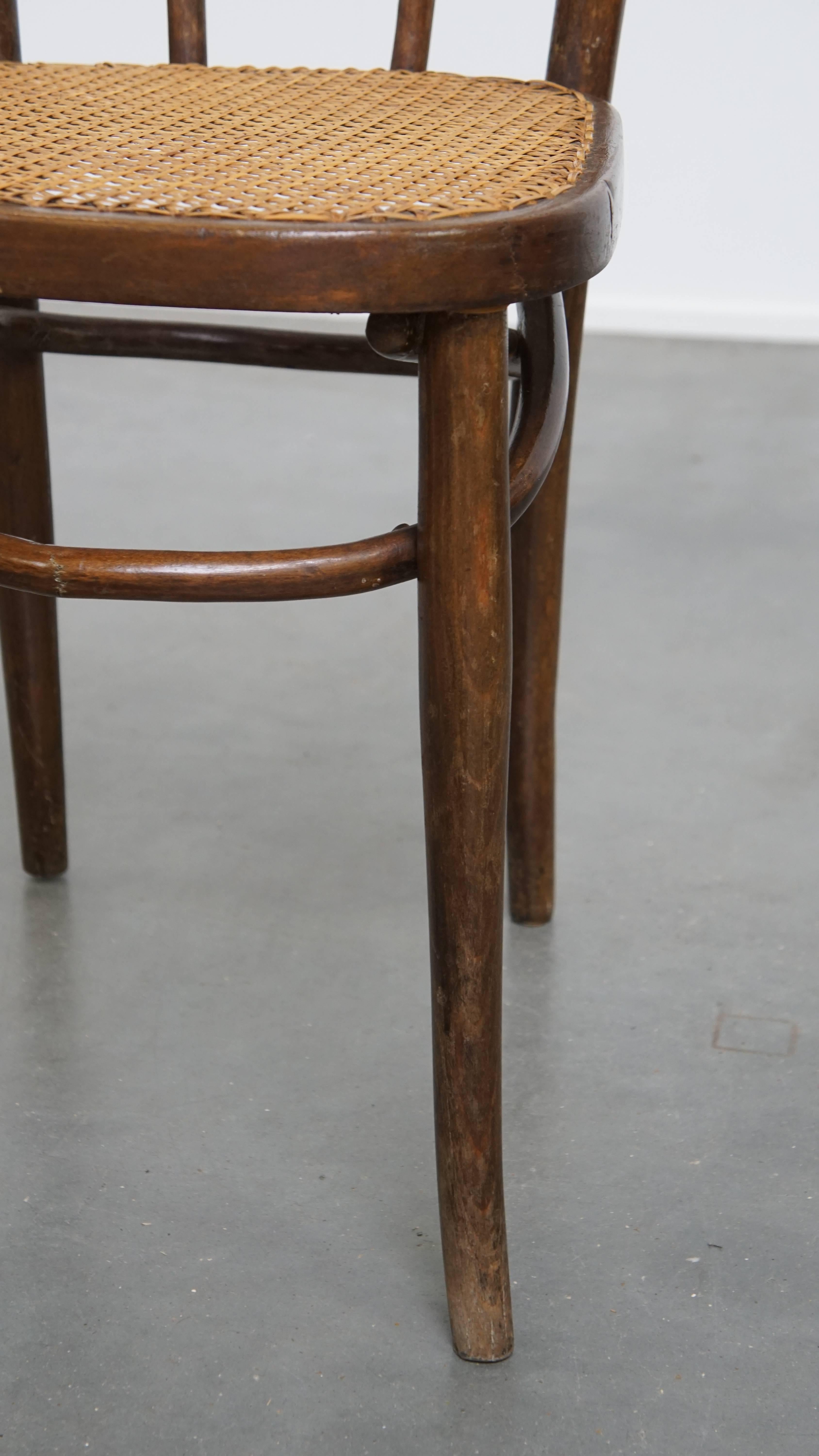 Bistro chair with a woven cane seat For Sale 1