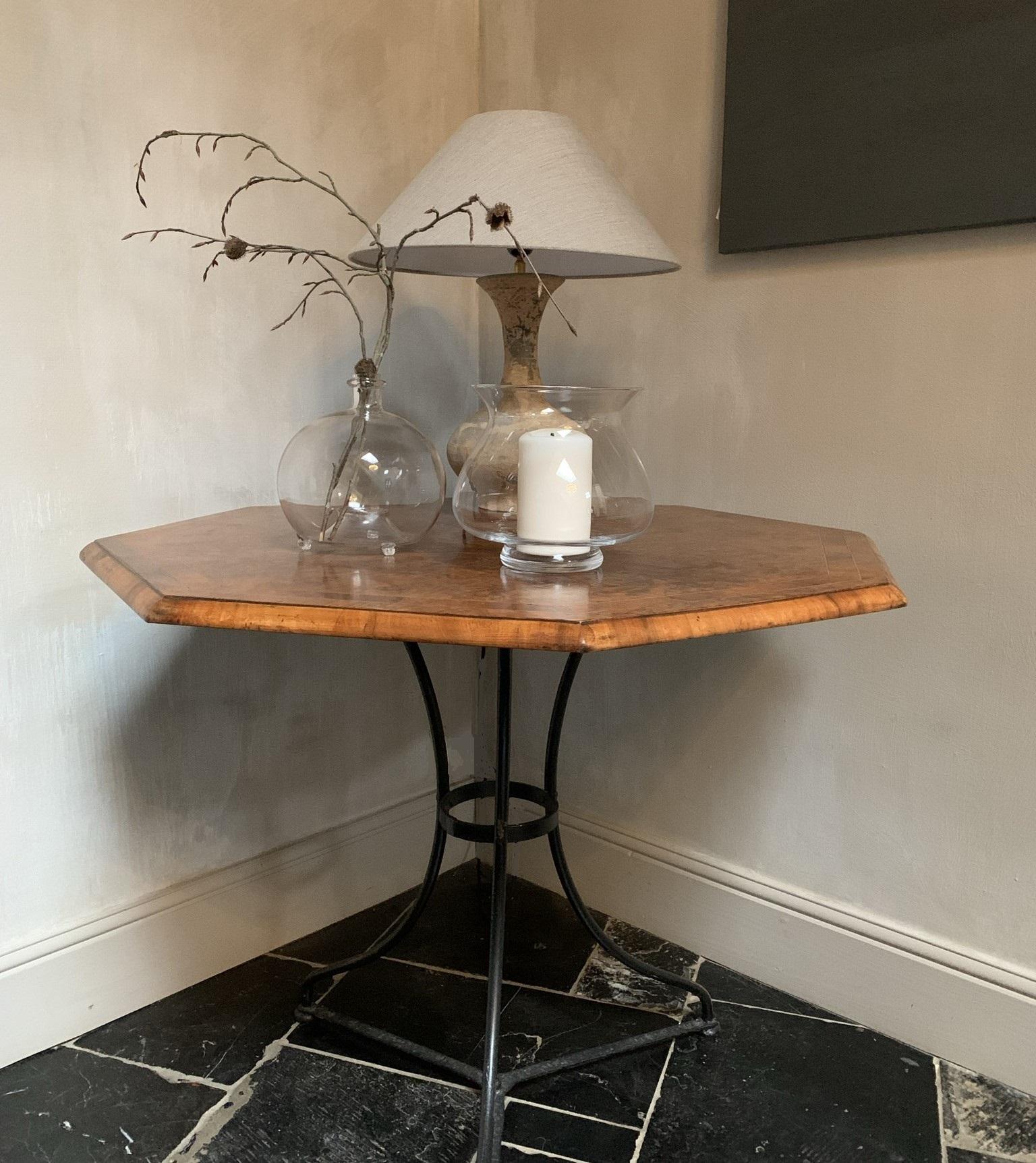 This table was, probably in the early 20th century, composed of the base of a bistro table and a 19th century octaganal top of great quality. The marriage is a good match and both complement eachother beautifully. Recycling is nothing new.