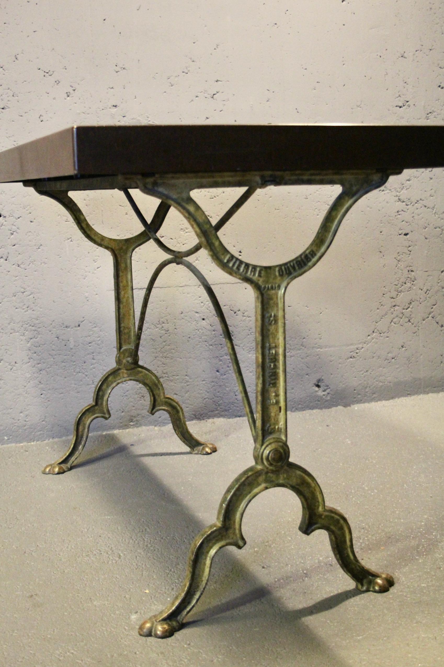 bistro table with a signed design, Bakelite top, and cast iron base For Sale 2