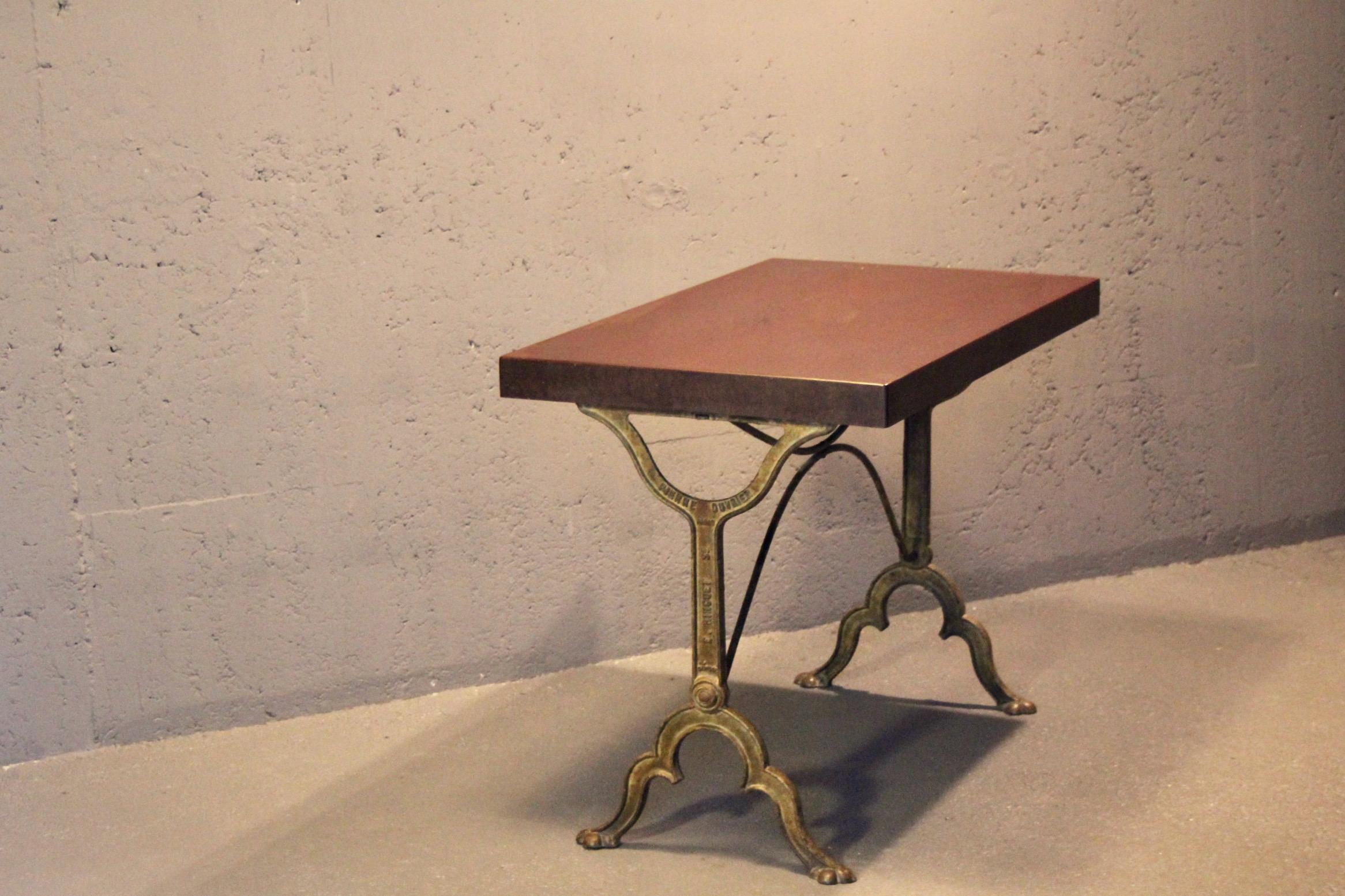 bistro table with a signed design, Bakelite top, and cast iron base For Sale 3