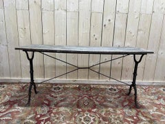 Bistro table with cast iron base and solid oak top