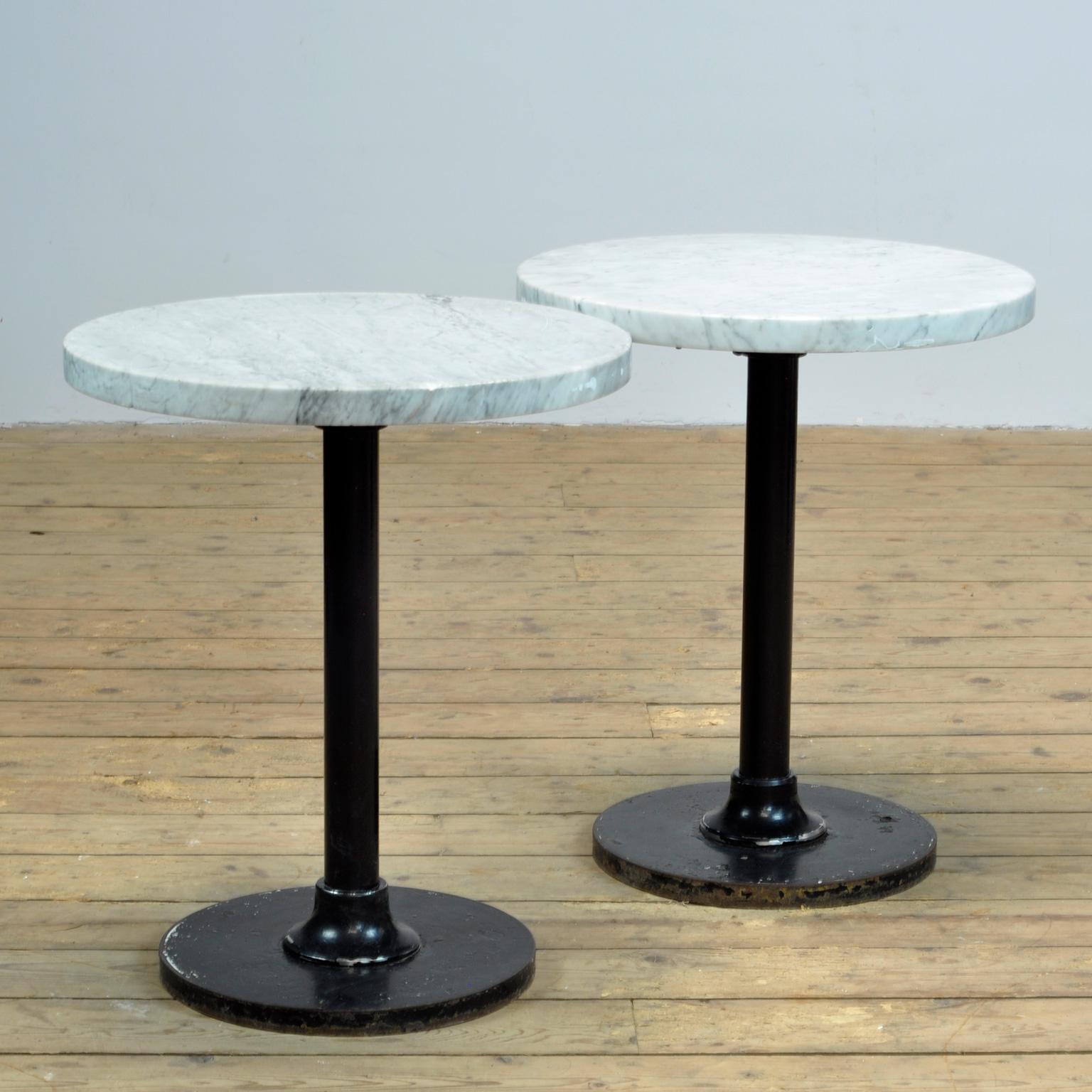 Vintage bistro or bar tables, with white marble top and black iron base. Produced in the 1950s in France.
Ideal for a bar or restaurant. Heavy quality, about 60 kg p.s. 4 pieces in stock. 
Price per item.