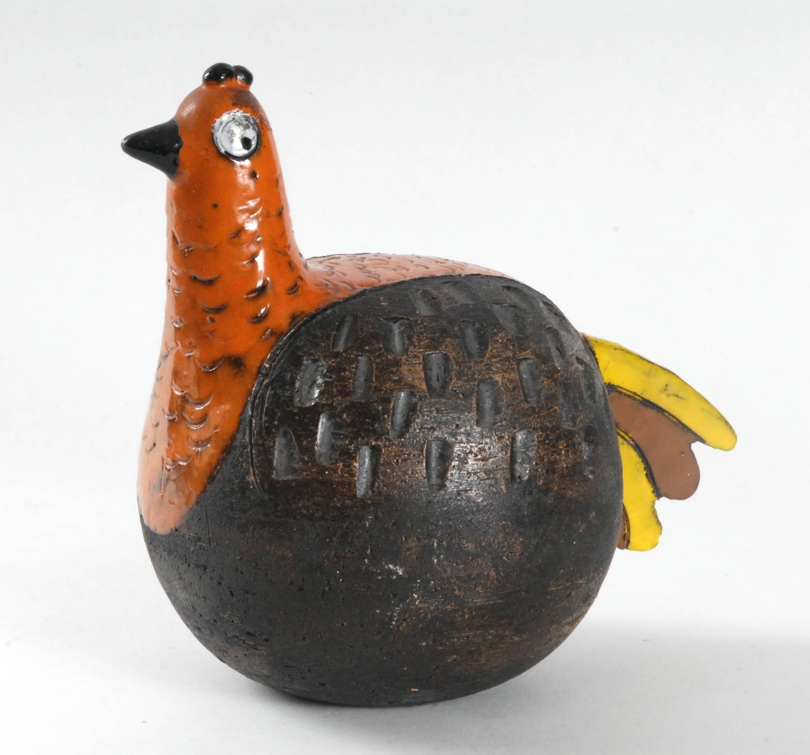 An Aldo Londi designed Gallina, [Hen] highly stylized and whimsical, this example in 
orange, manganese-brown and yellow glazes with impressed and sgraffito patterns. A rare and collectable piece.