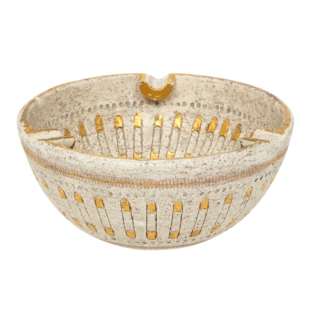 Aldo Londi Bitossi Ashtray, Ceramic Safety Pin, Gold and White. Signed. Small to medium scale ashtray with three cigarette rests. Decorated with a pattern of gold glazed safety pins over white on both the interior and exterior. Signed with Impressed