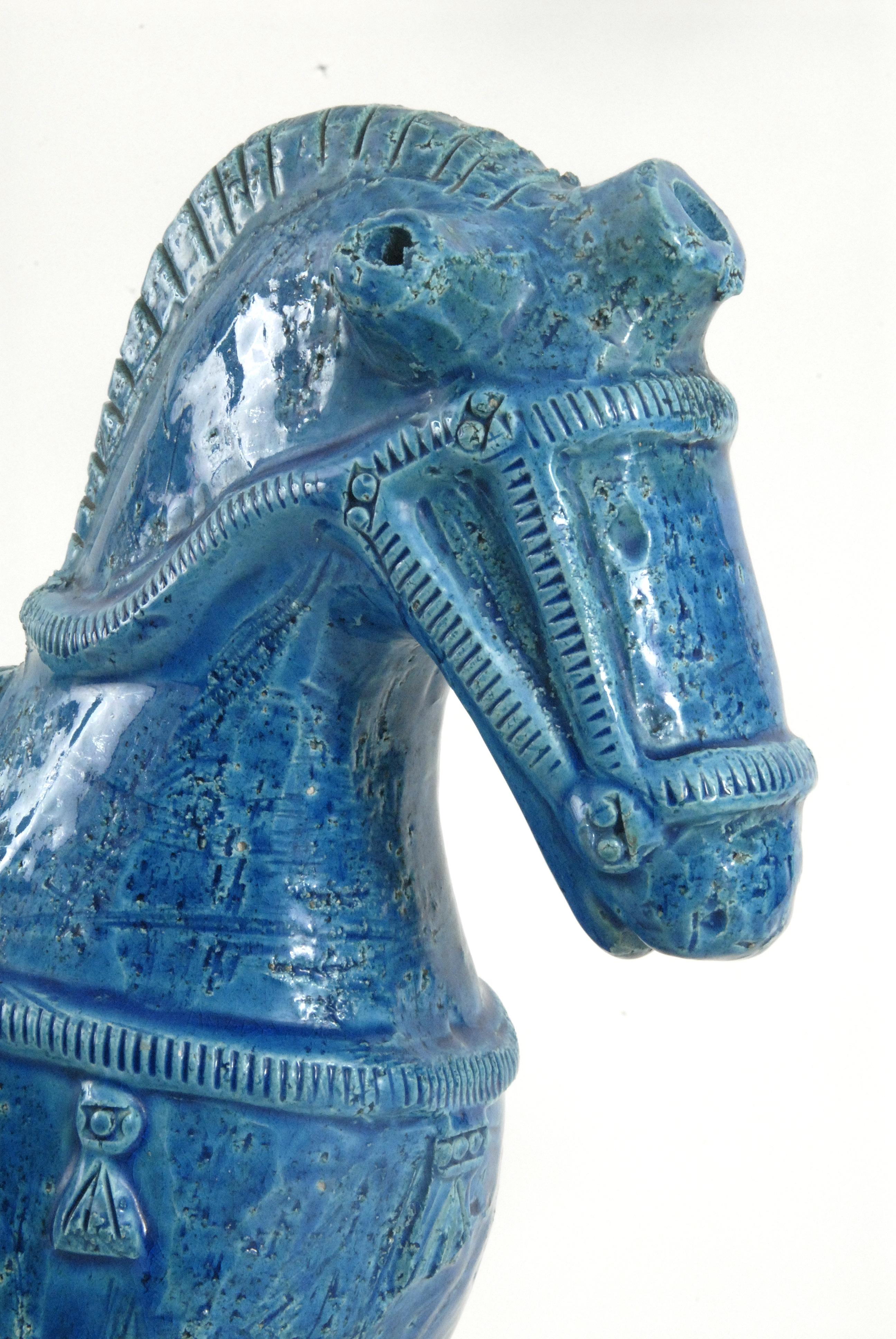A large Aldo Londi designed horse for Bitossi in a sky blue glaze with good detail to the saddle and other trappings.