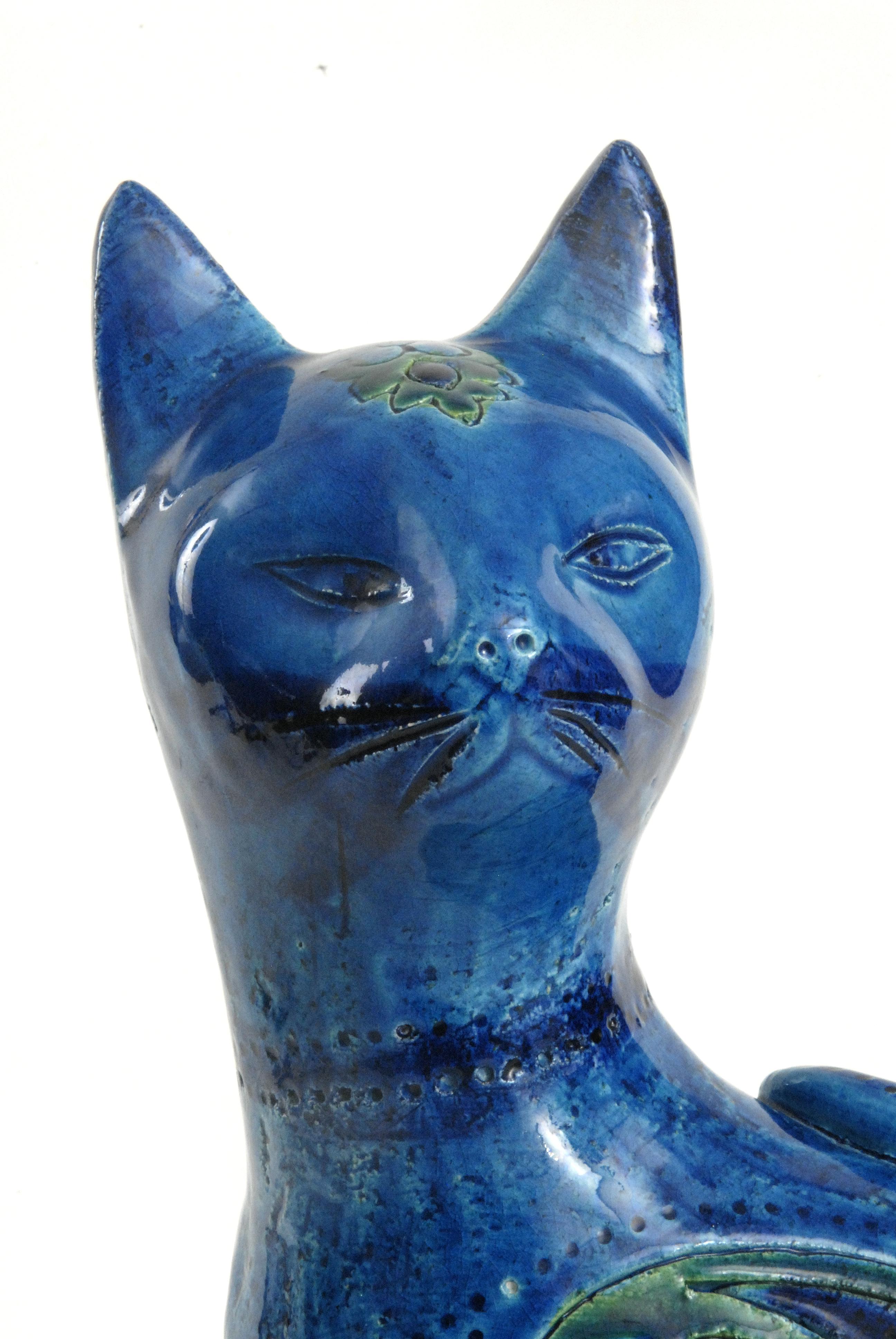 A brilliant blue glazed sitting cat with impressed paisley shaped motifs called the 'Liberty' pattern. Designed by Aldo Londi for Bitossi in the 1960s.