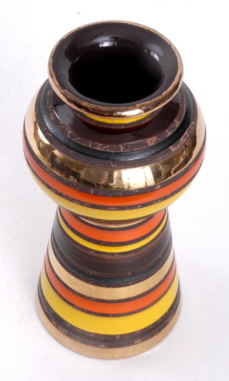 A very bright Aldo Londi designed vase with a ball shaped swelling near the top. Acid resist glaze techniques with many colors and gold bands. Thailand pattern colour way.