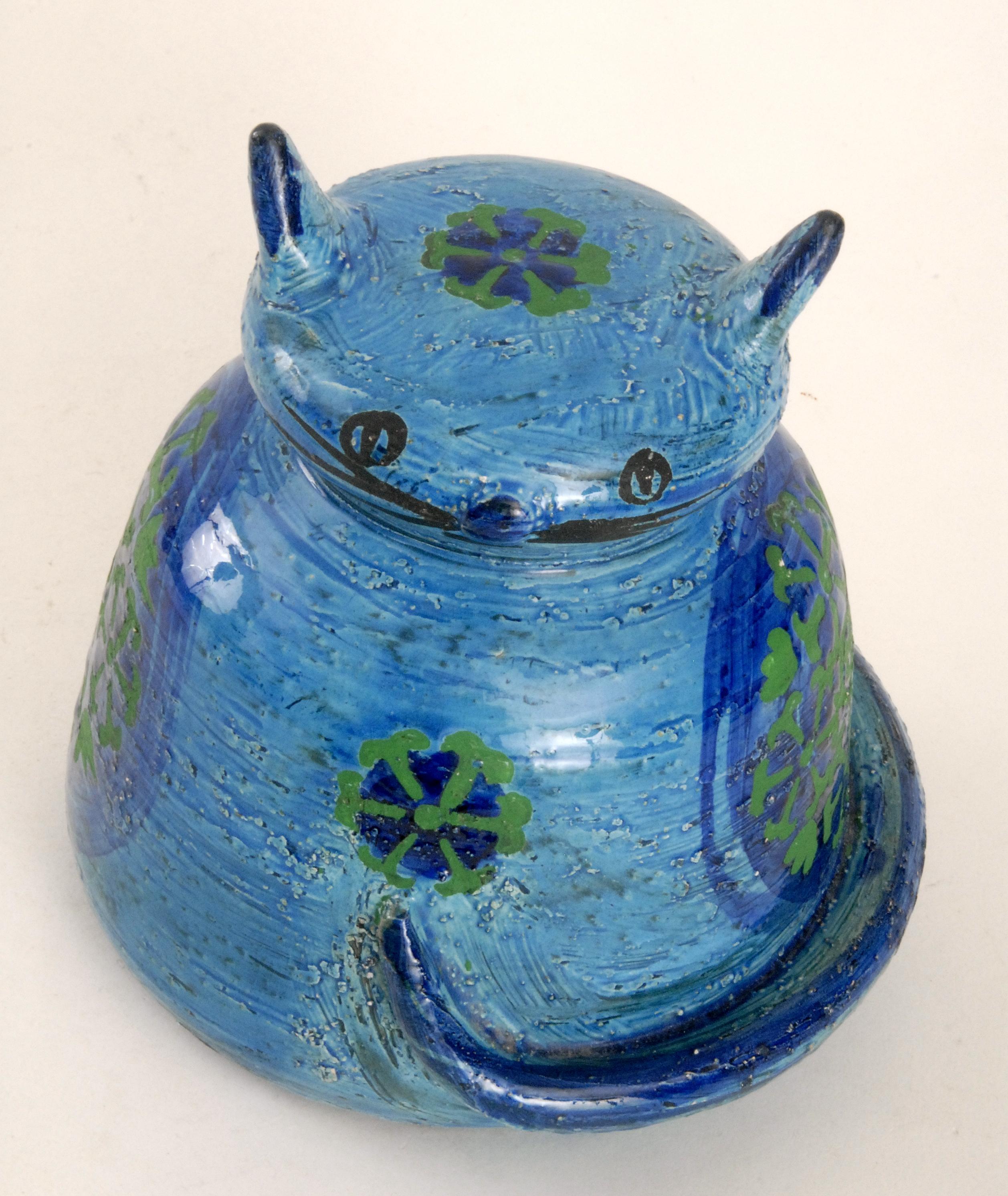 A whimsical Aldo Londi cat money box with acid resist decoration medallions to the sides.