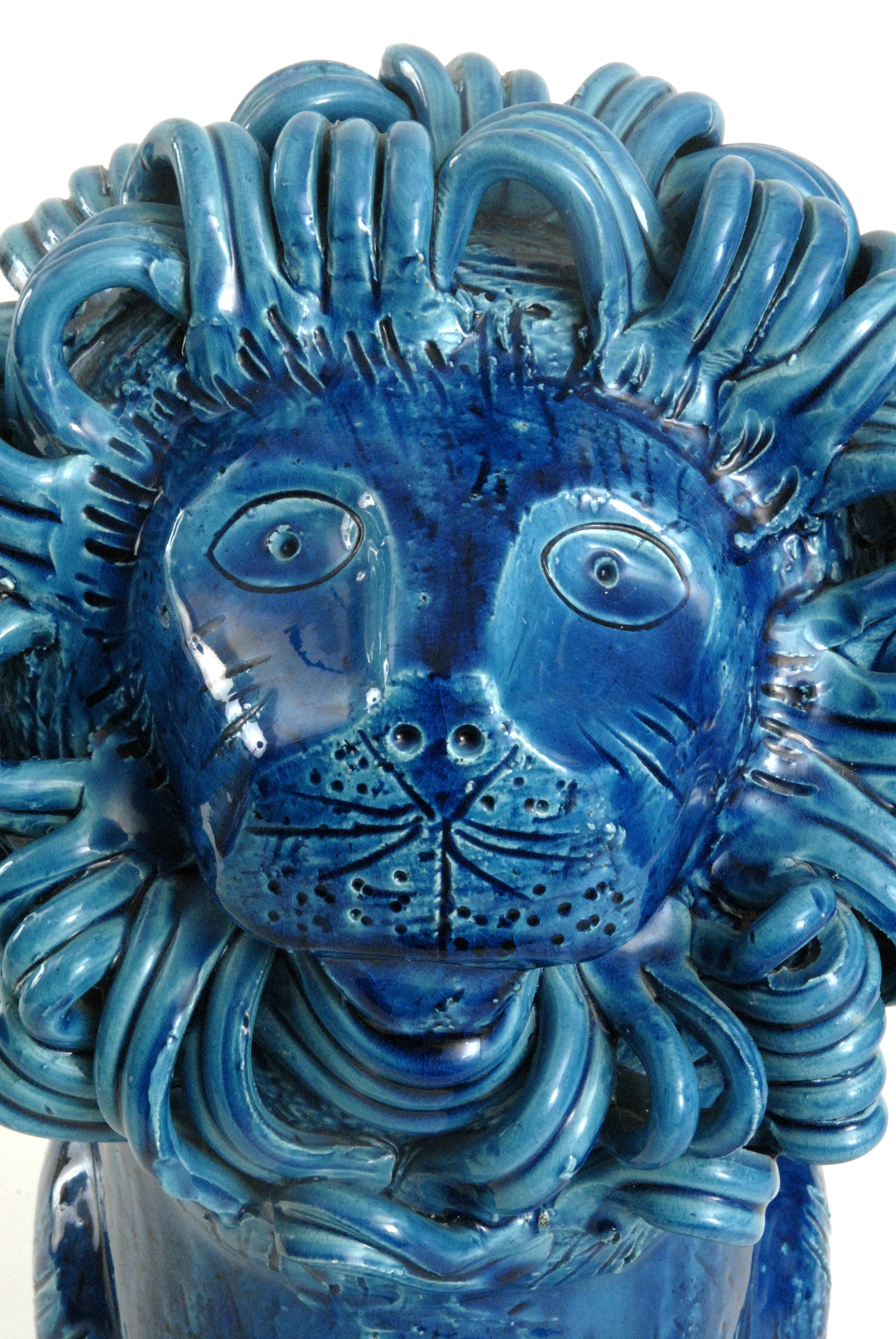 A magnificent large sitting blue Lion with an intricately detailed mane. This would make a wonderful centre-piece for any collection of Italian ceramics. With original paper label to underside. A rare piece.