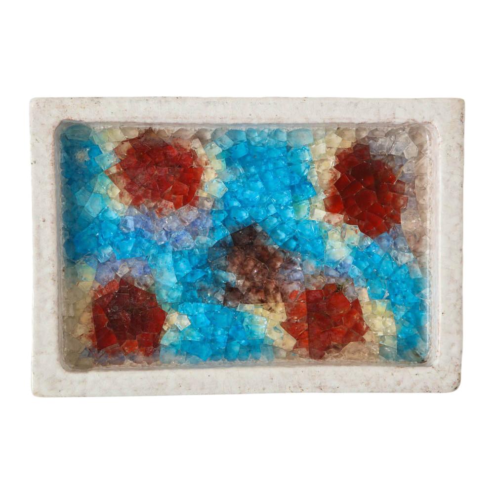 Bitossi bowl, ceramic and fused glass, white, red and blue, signed. Medium scale white glazed rectangular low bowl with fused glass mosaic interior pattern of light and dark blues, reds, and yellow. Signed: 285 Italy on underside.
 
