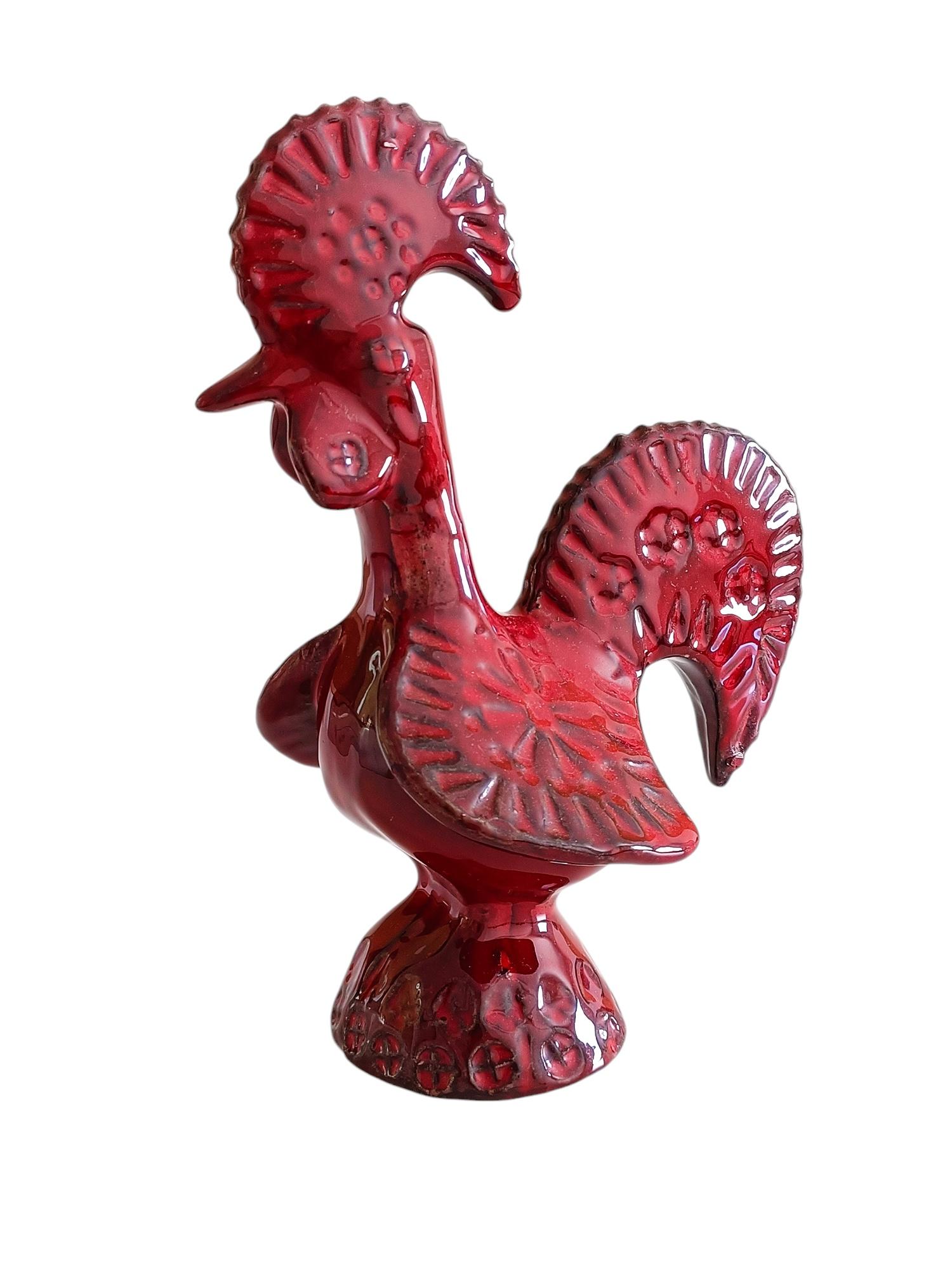 Gallo de cerámica Bitossi de Aldo Londi, con un raro esmalte de color sangre de buey. Hecho a mano en Flavia Montelupo hacia la década de 1960.

Absolutamente preciosa en la mano. En perfecto estado. 

Dimensiones:
H. 19,5 cm (7,70 pulg.)
W. 15cm