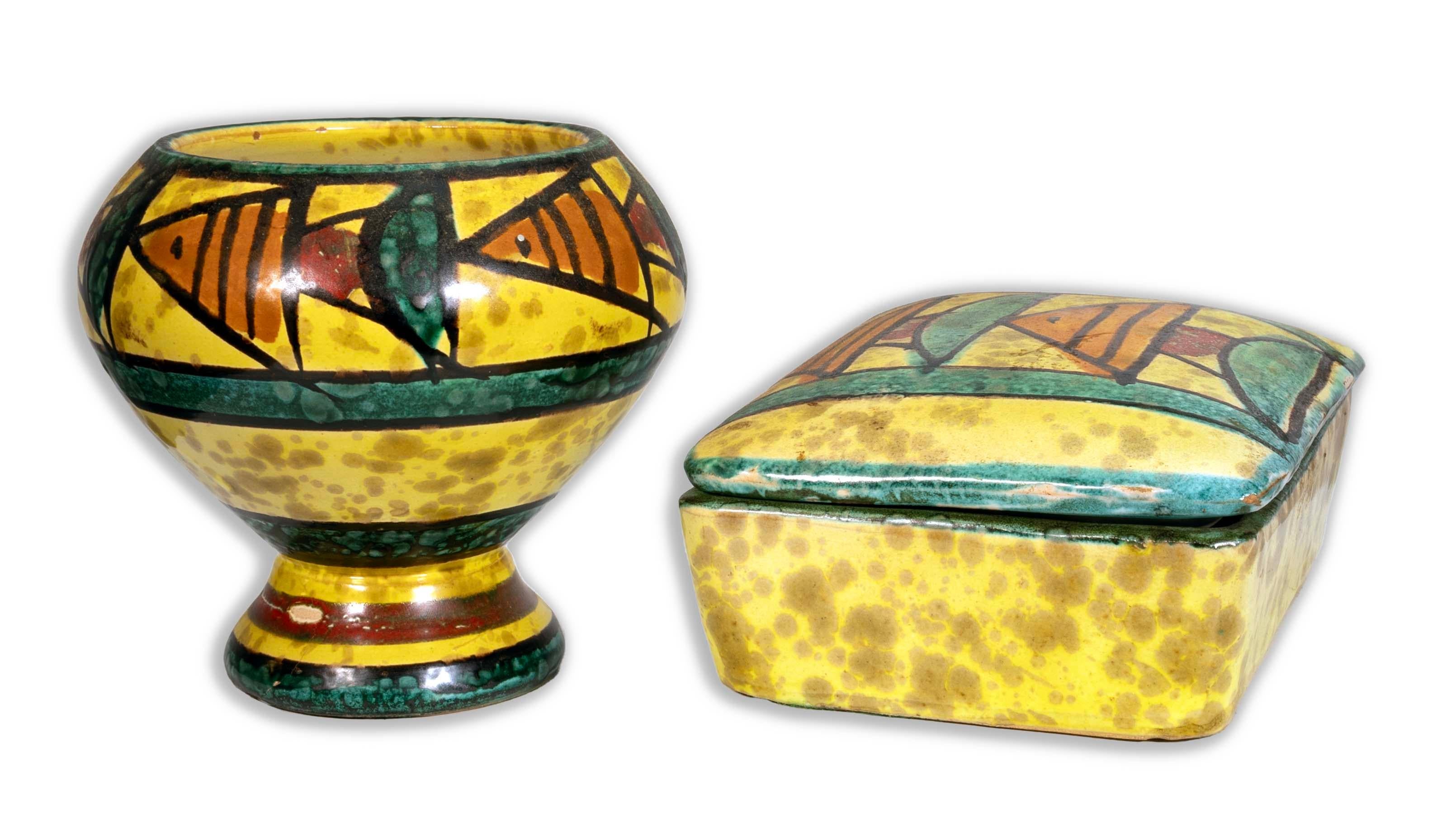 Vibrant and whimsical, this Bitossi Trinket Box and Vase set features an eye-catching abstract fish pattern, beautifully hand-painted in bold colors. Crafted in Italy, these pieces showcase the distinctive, playful style that Bitossi is renowned