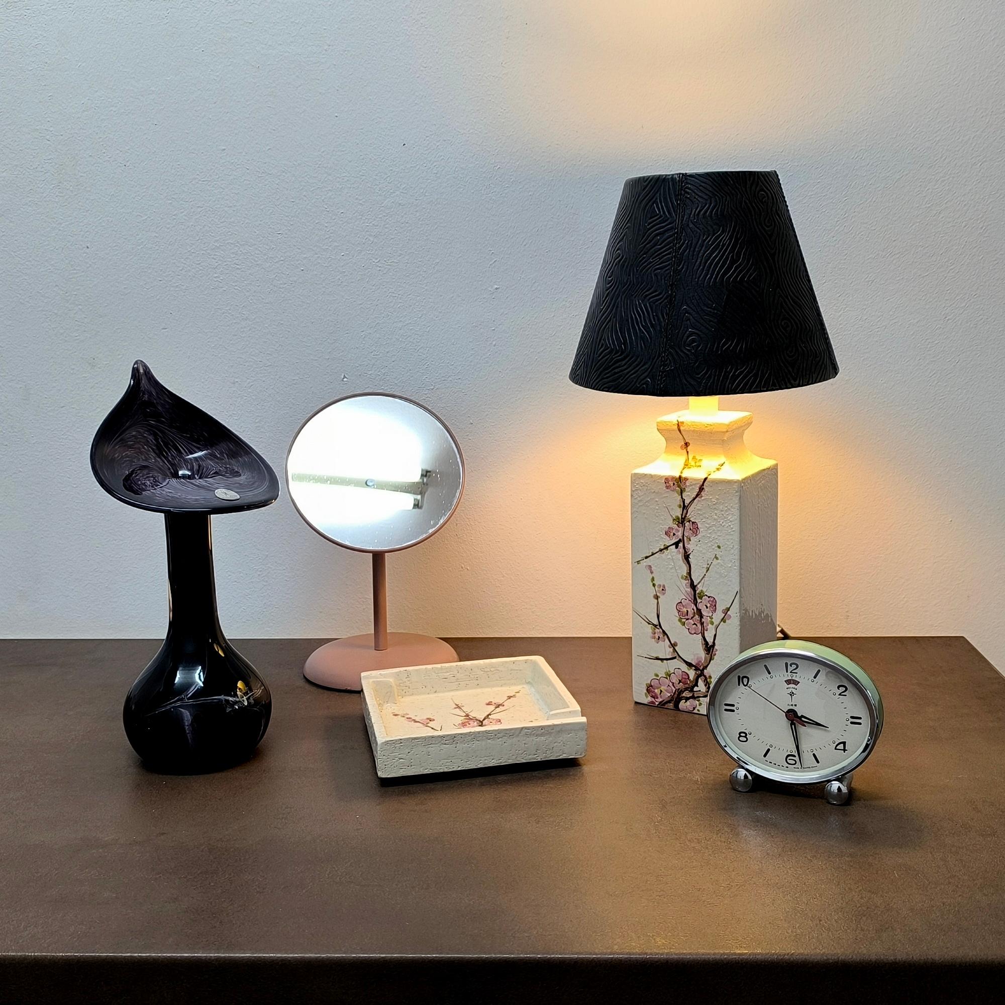 A rare and evocative ceramic pairing from Bitossi’s Flavia line, this vintage Italian table lamp and matching ashtray (or vide poche) exemplify the studio’s mid-century fusion of sculptural form and painterly surface. Each piece features a