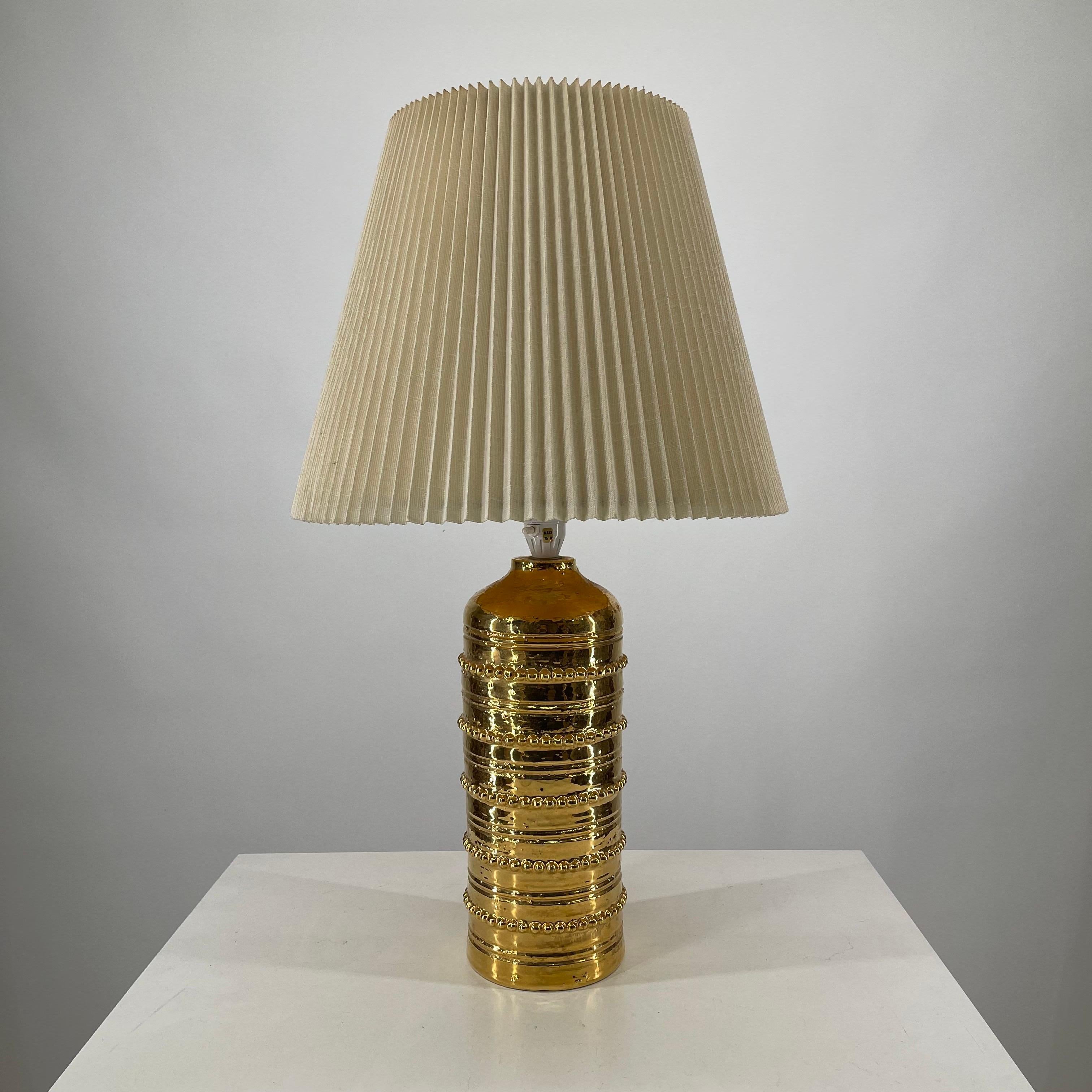 Bitossi Gold glazed ceramic table lamp by Falkenbergs Belysning of Sweden, 1965. Comes with original shade.