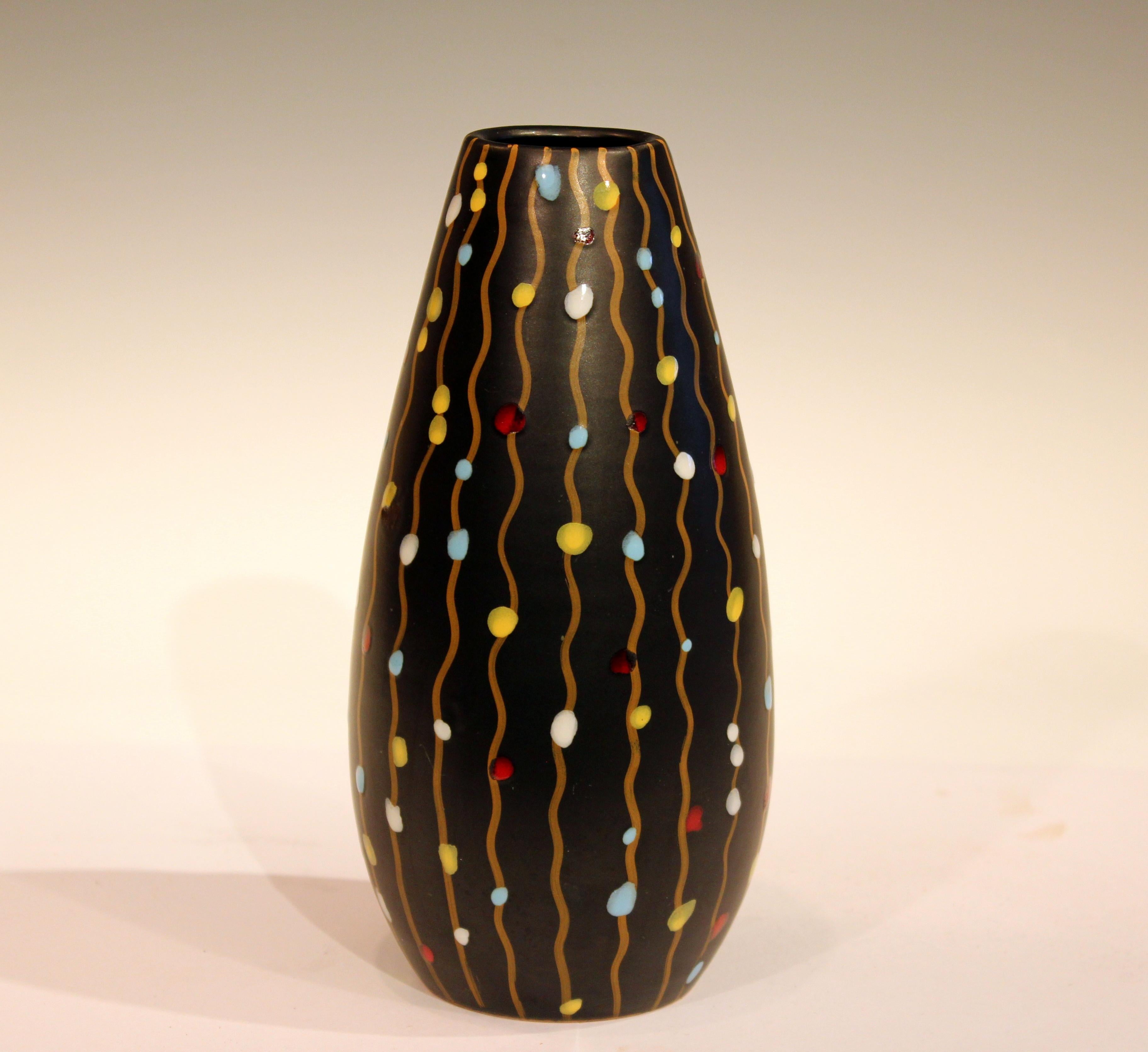 Early V mark 1950s Bitossi vase decorated with hanging party lights on a black ground, circa 1950s. 8 1/2