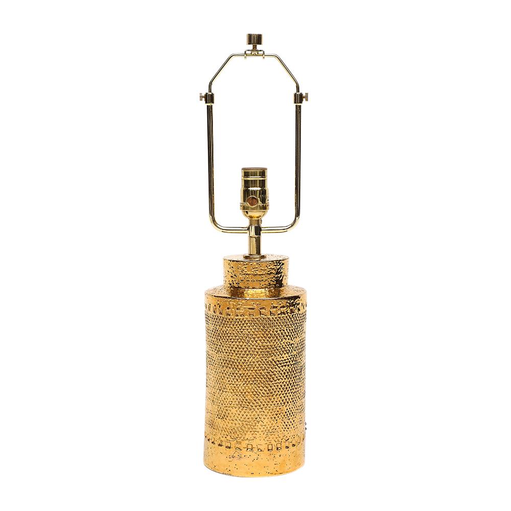 Bitossi Lamp, Ceramic, 24K Metallic Gold, Textured. Small scale cylindrical table lamp with stepped neck and stippled textured body. The Bitossi factory mixed 24-karat gold to achieve the luster to their gold glazes. Newly rewired and fitted with a