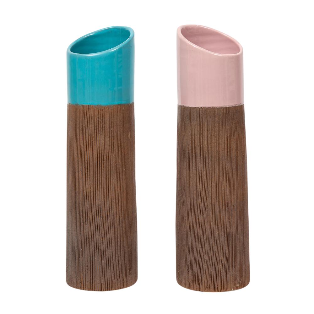 Bitossi vases, ceramic, pink, blue, ribbed, signed. Pair of tall lipstick form vases with pastel colored necks and ribbed raw clay bodies. Both are signed on their undersides: Blue 