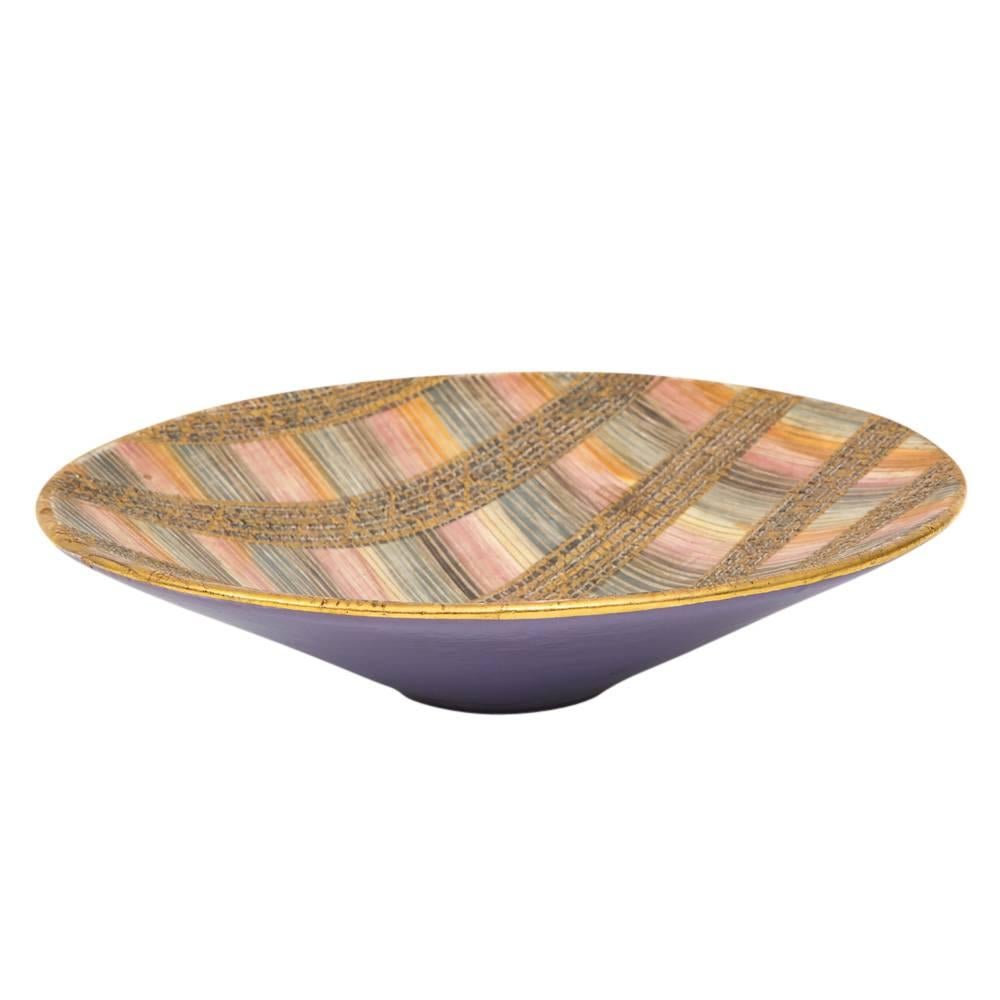 Aldo Londi Bitossi seta bowl, ceramic, pink, gold and blue, signed. Medium to large scale low bowl glazed in pink, gold and blue from Londi's iconic seta (Silk) pattern. The underside is glazed in lavender and signed: 870 Italy. Retains original RIN