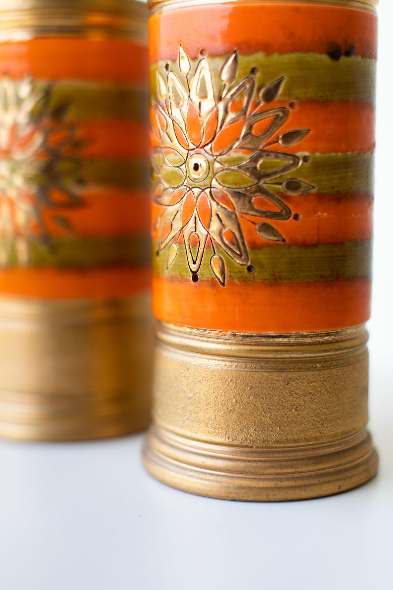 Manufacturer: Bitossi

Importer: Rosenthal Netter
Period or model: Mid-Century Modern. 
Specs: Pottery

Condition: 

These Bitossi orange and gold vases for Rosenthal Netter are in good condition. There are a couple imperfections in the