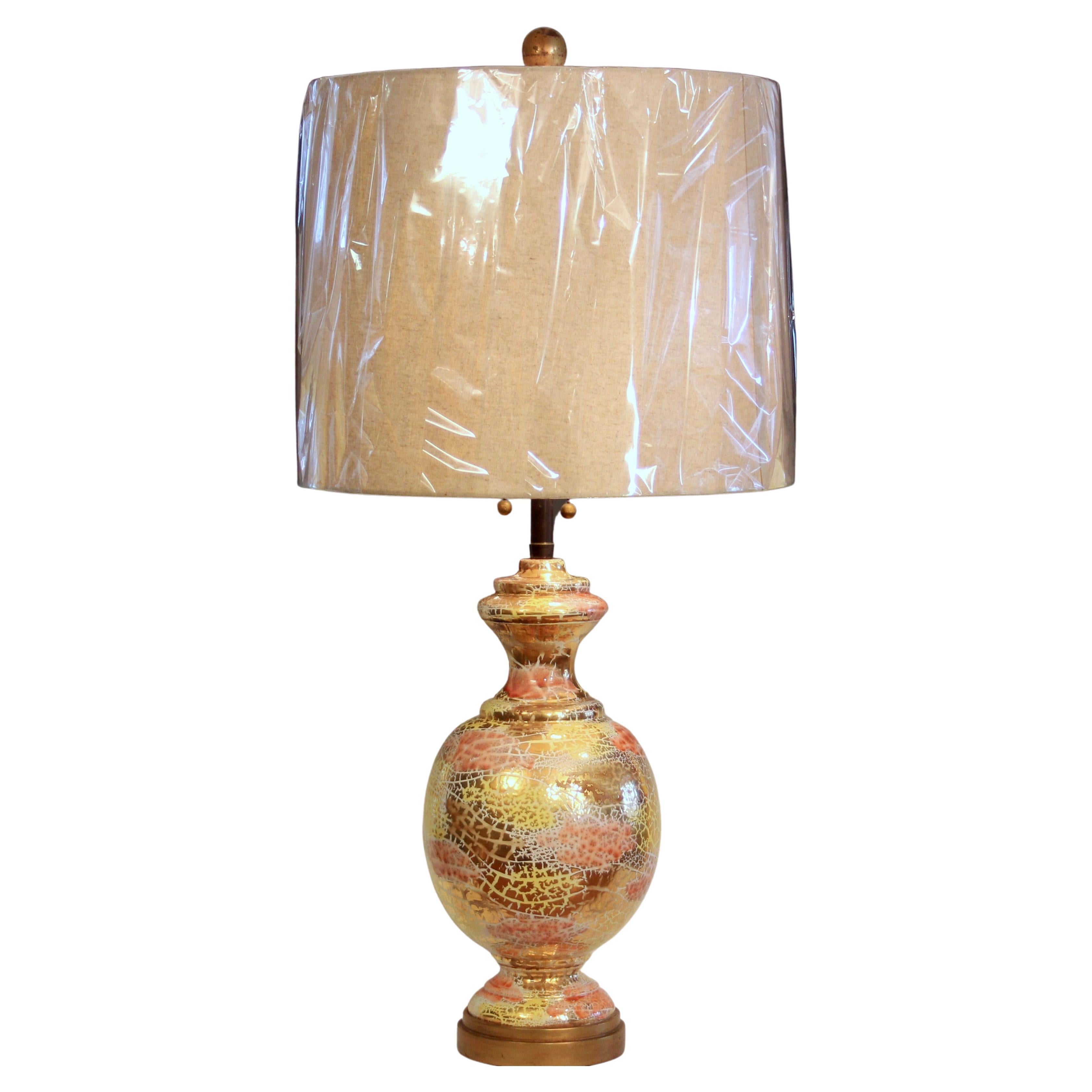 Large Bitossi lamp in Oro Rotto decor for the Marbro Lamp Company, circa 1960's. Gilt wooden base. Double socket cluster with smooth pulls. Extra large gilt wood finial. 45