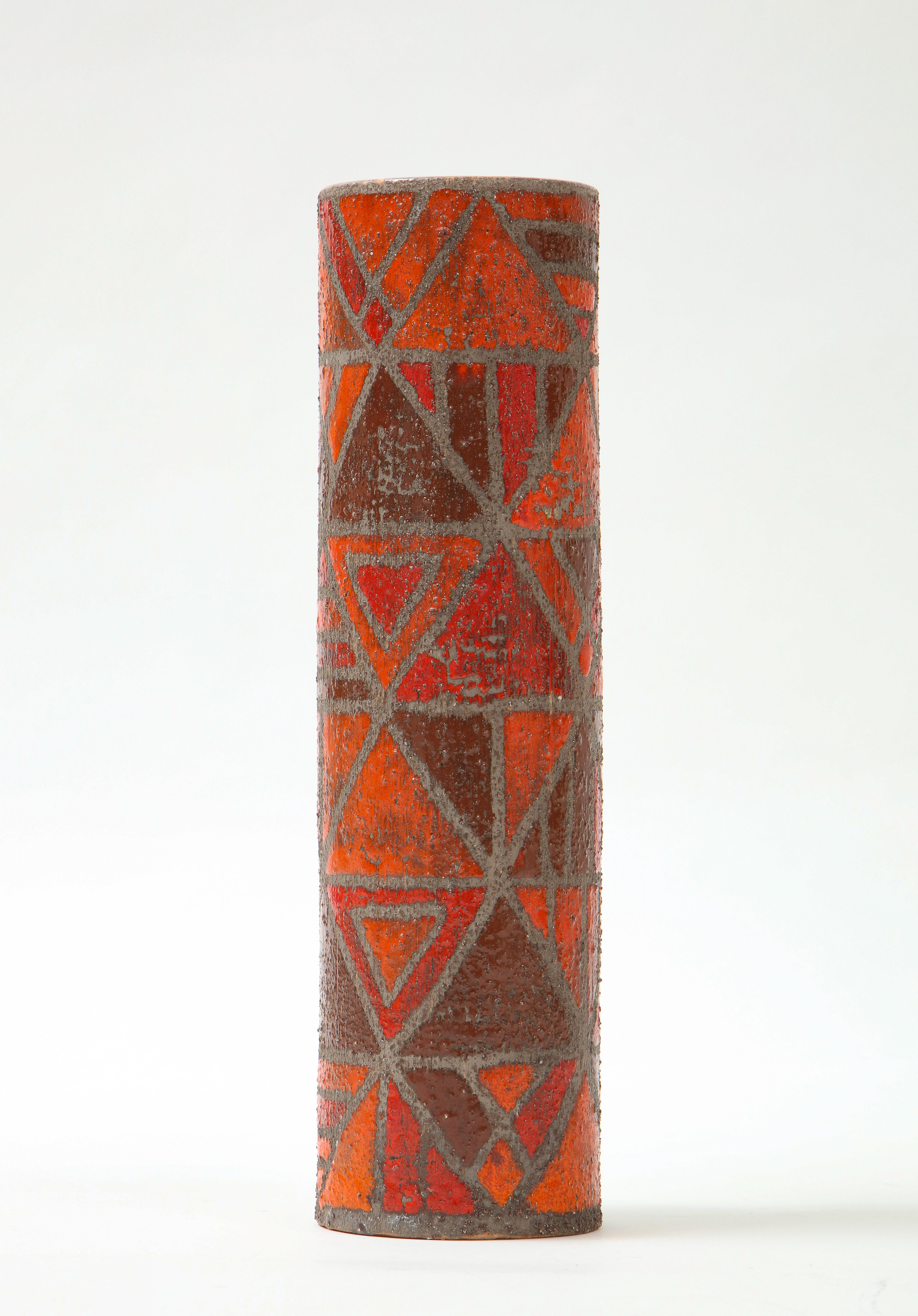 Italian mid century vase featuring an abstract geometric pattern in tones of orange-burnt orange. Signed.