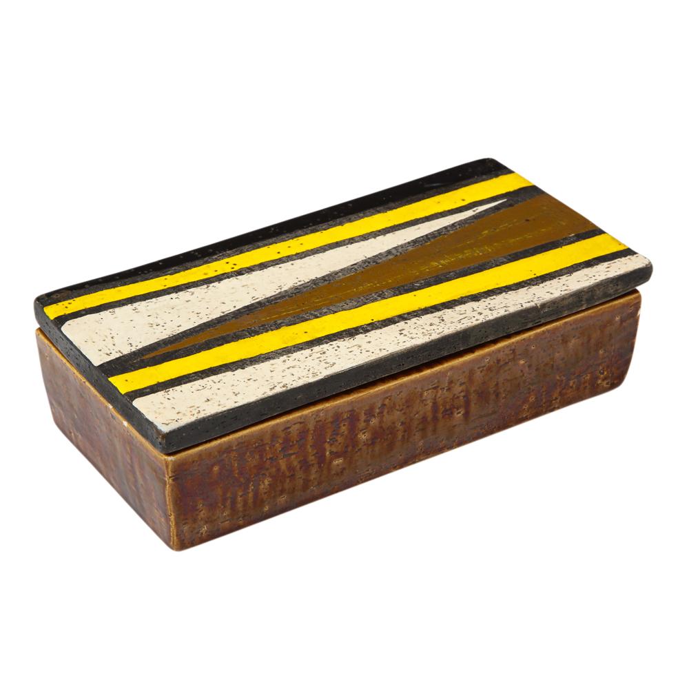 Bitossi for Rosenthal Netter box, ceramic, yellow, black, white, brown, geometric, signed. Small scale lidded box decorated with angular geometric pattern in yellow, white, and black over a brown glaze. Signed with a paper label on the underside of