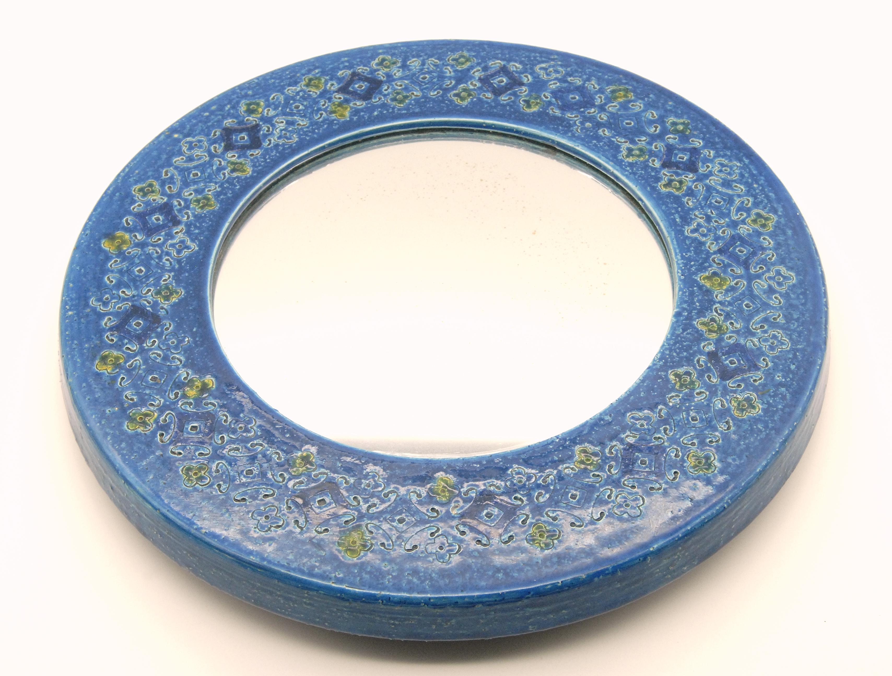 A rare circular mirror frame designed by Aldo Londi for Bitossi in the mid-1960s. 'Spagnoli' pattern in blue.
