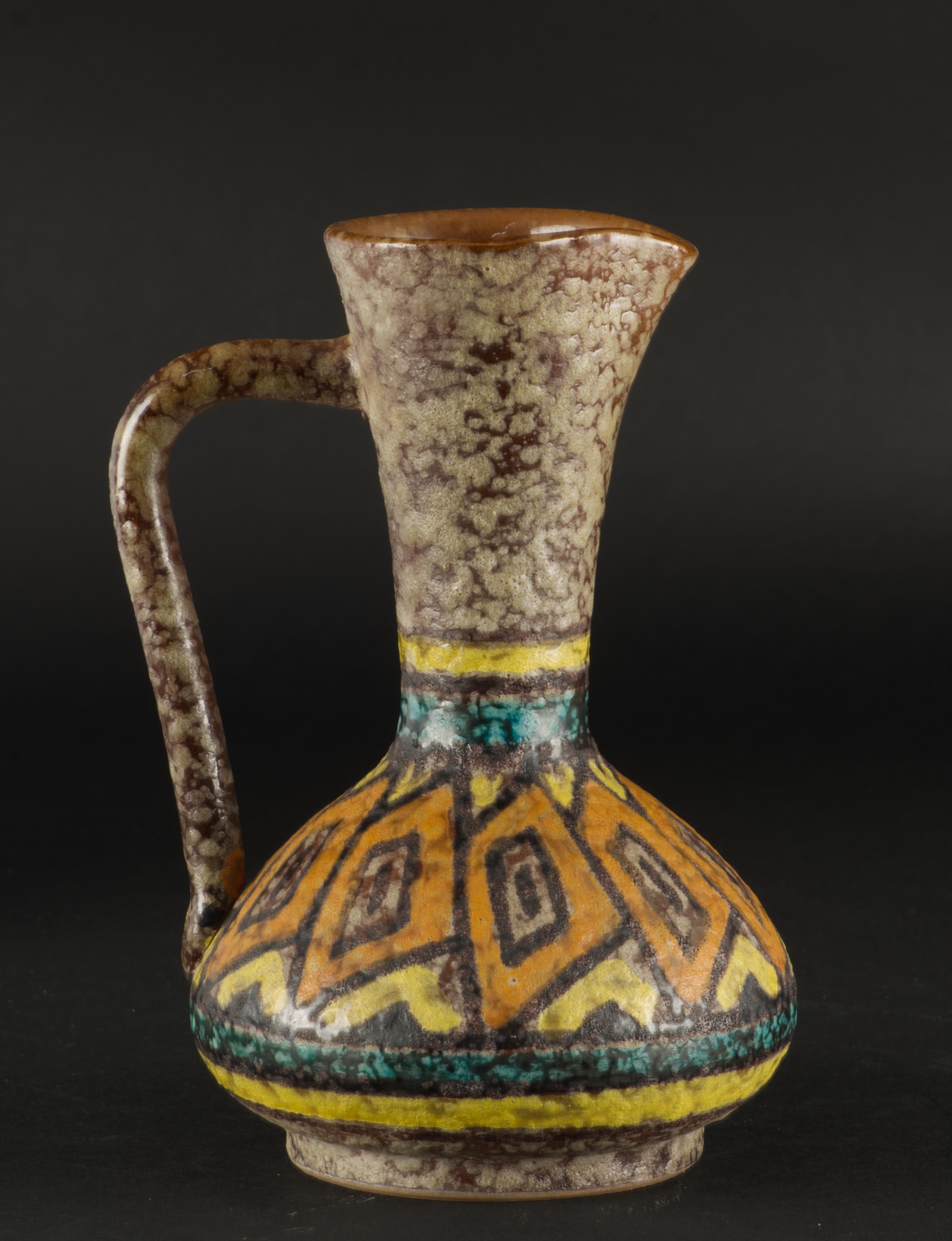 Bitossi Studio Pottery vase or pitcher is a beautiful example of Italian mid-century modern art ceramics. It is decorated in bold abstract pattern using gloss, semi-matte, and lava glazes, creating a textured, tactile surface. Dominant earthy tones