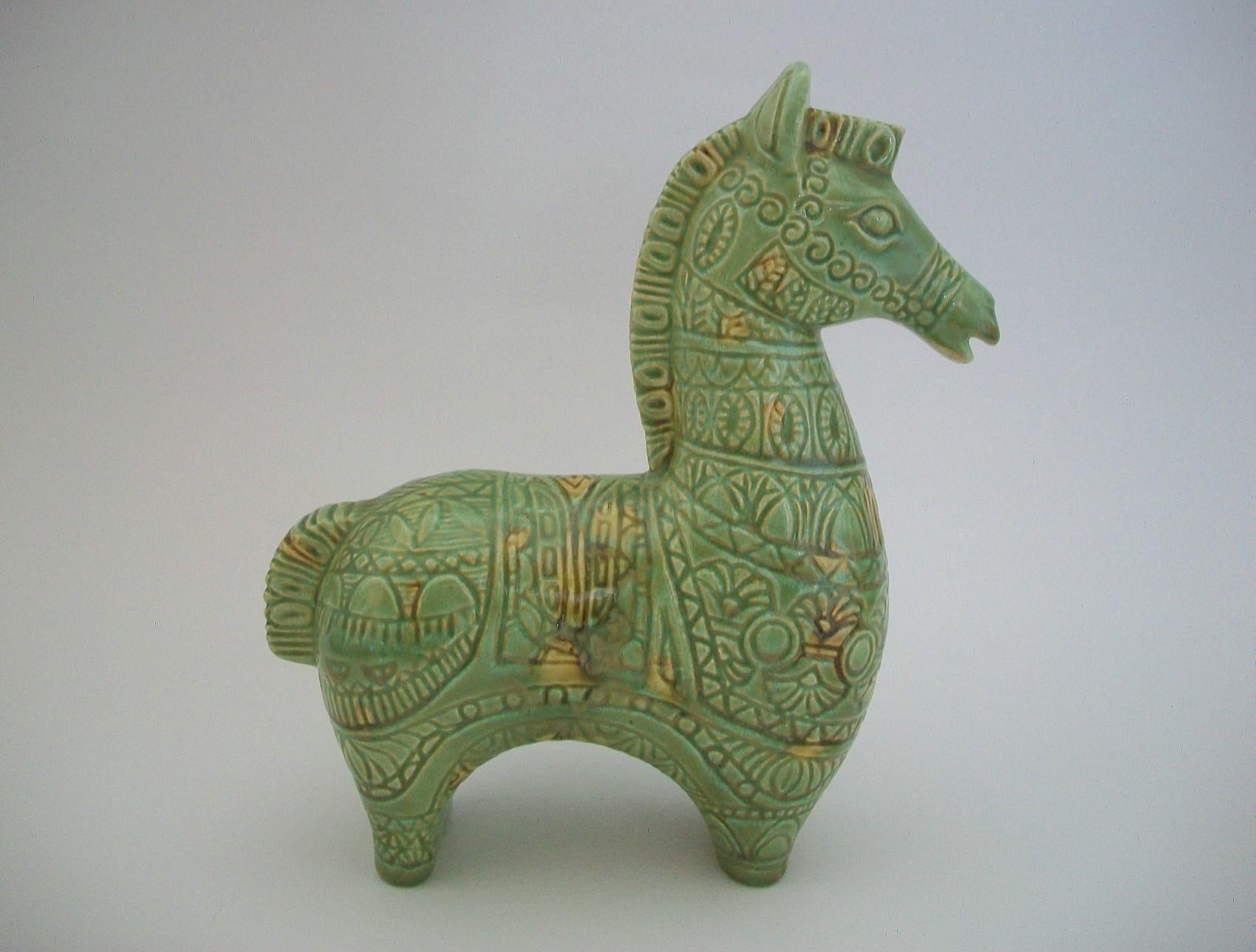 Mid Century Bitossi style studio pottery glazed ceramic Trojan horse - featuring an articulated molded form with a celadon glaze and random amber splashed highlights - unsigned - Canada (likely) - mid 20th century.

Excellent / mint vintage