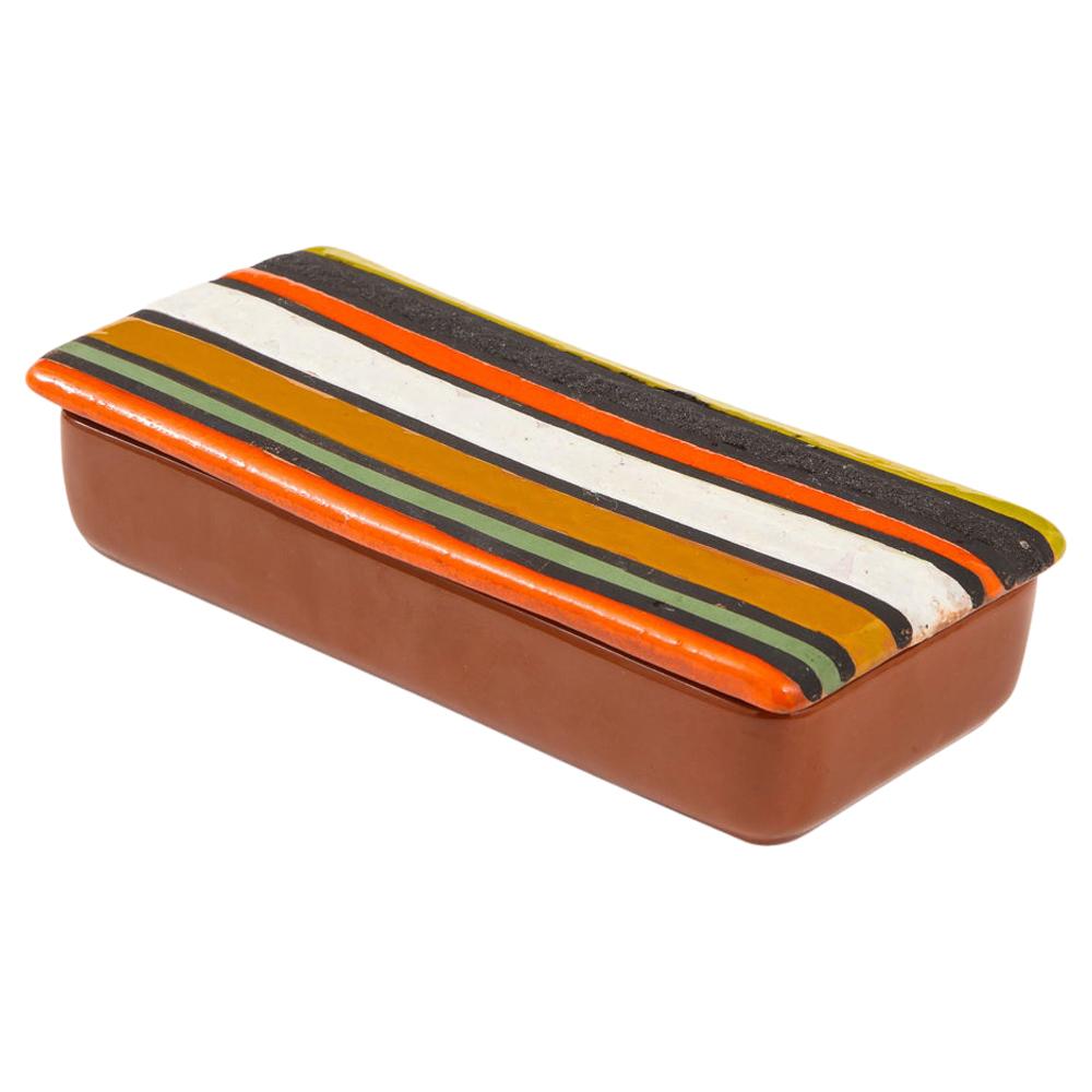 Bitossi Thailandia box, ceramic, orange, white, brown, stripes, signed. Hard to find small scale lidded box from Aldo Londi's Thailandia series with a top glazed in orange, mint green, caramel brown, white, coarse matte brown, and chartreuse. The