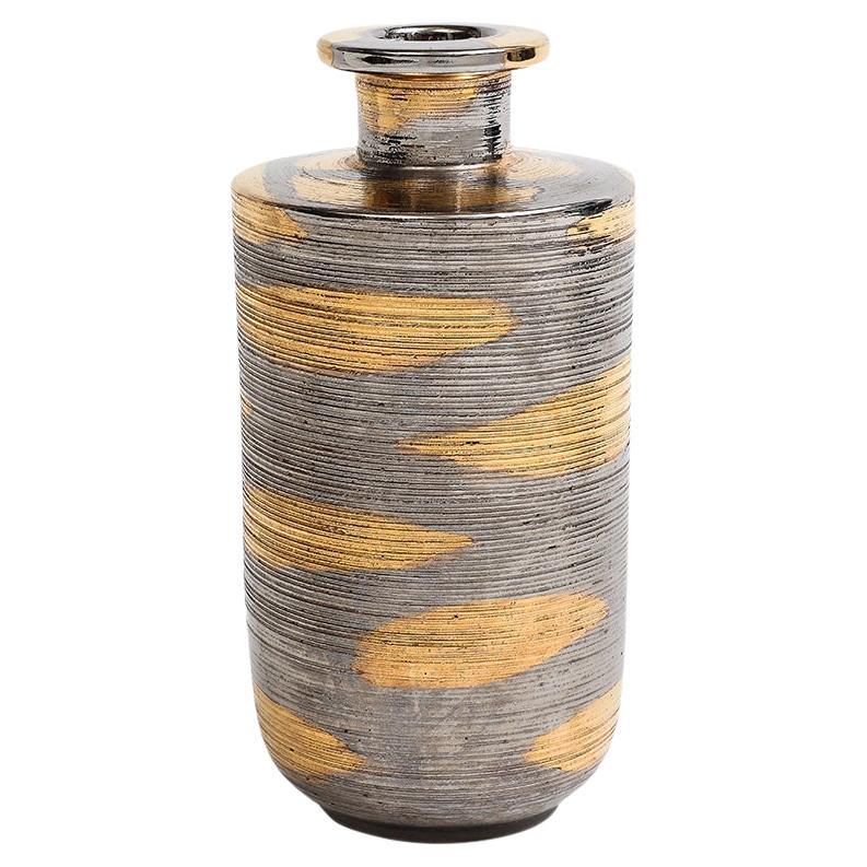 Bitossi Vase, Ceramic, Abstract, Brushed Metallic, Gold, Platinum. Small to medium scale vase with slightly elongated cylindrical neck, flat shoulders, and a rounded body. Glazed in an abstract pattern of brushed chrome and gold metallic. Measures